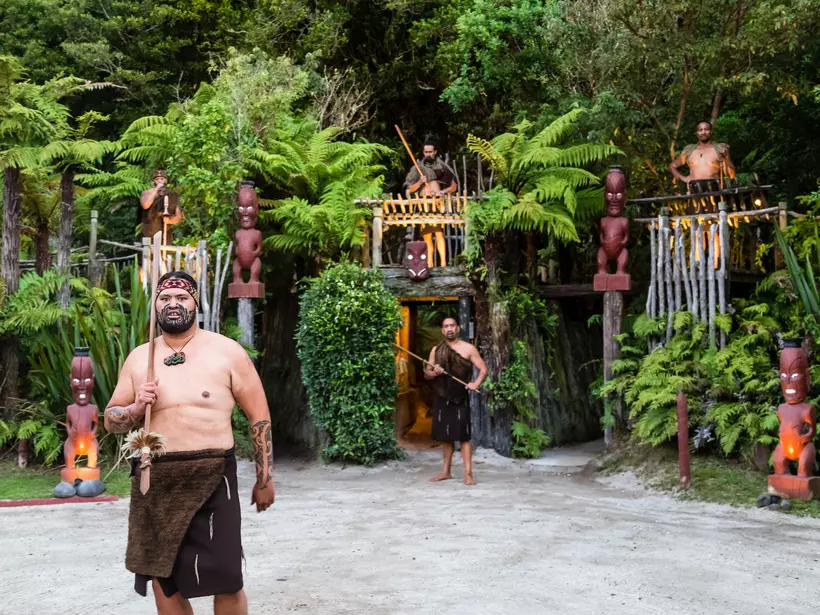 A Maori man wears traditional dress at a Maori cultural display in New Zealand.