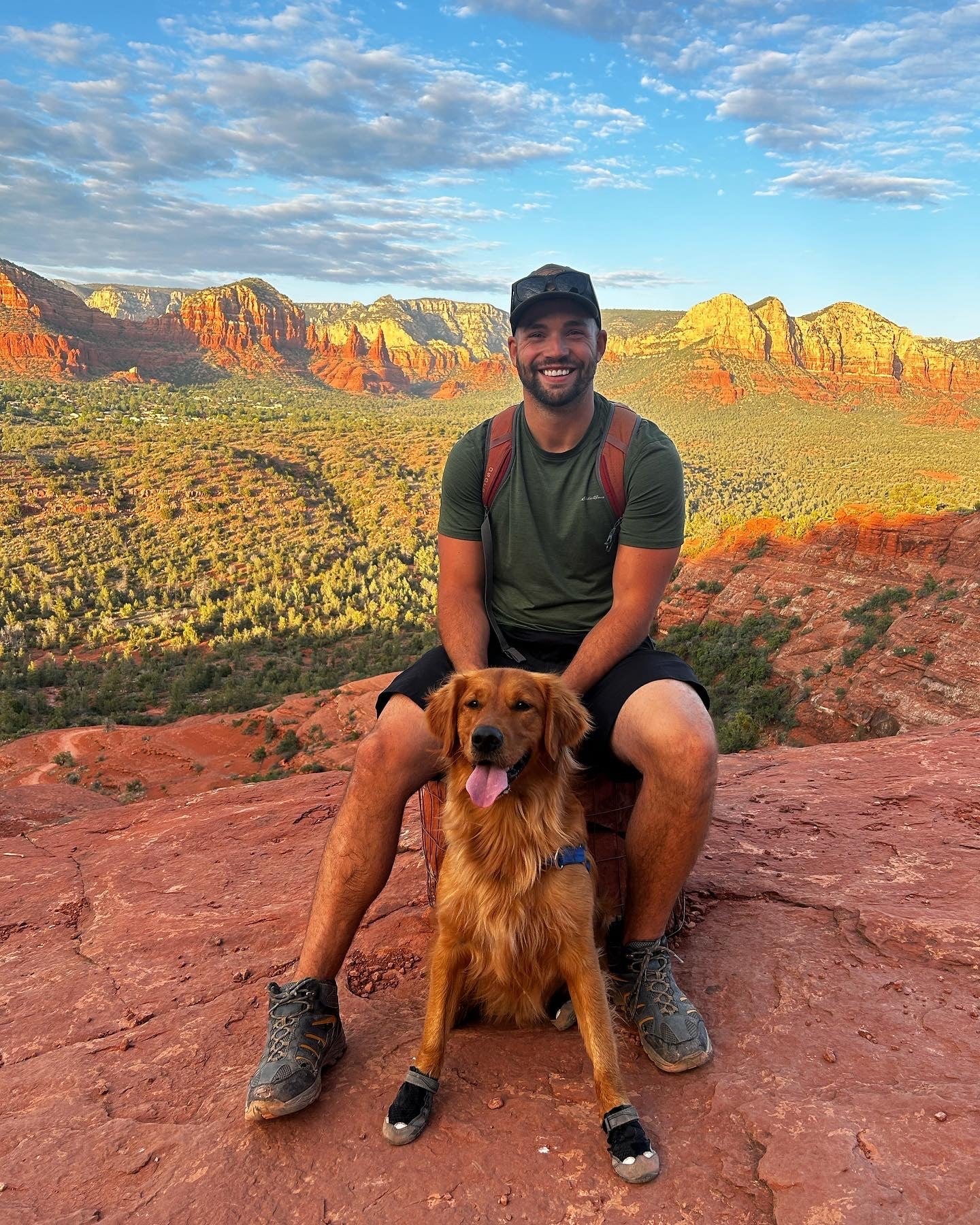 Greg Chabursky posing with his dog.