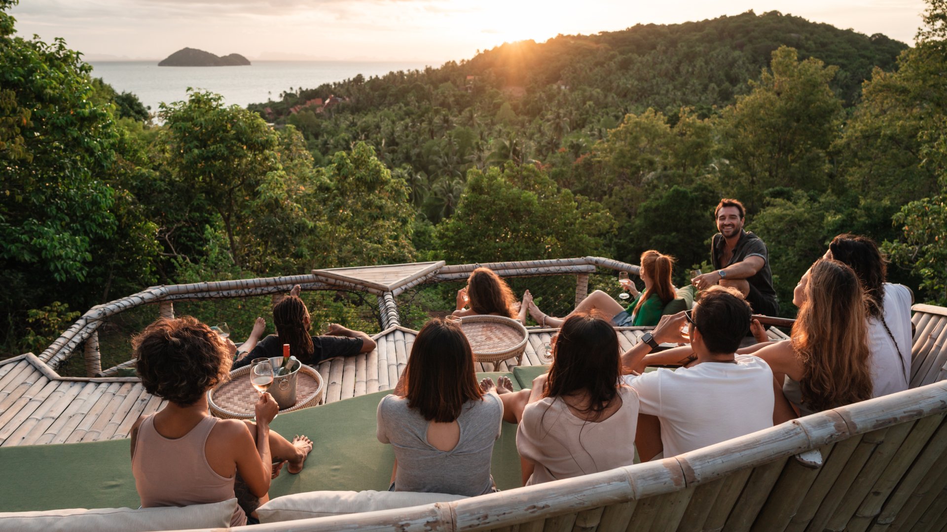 Group enjoys watching a sunset from a viewpoint