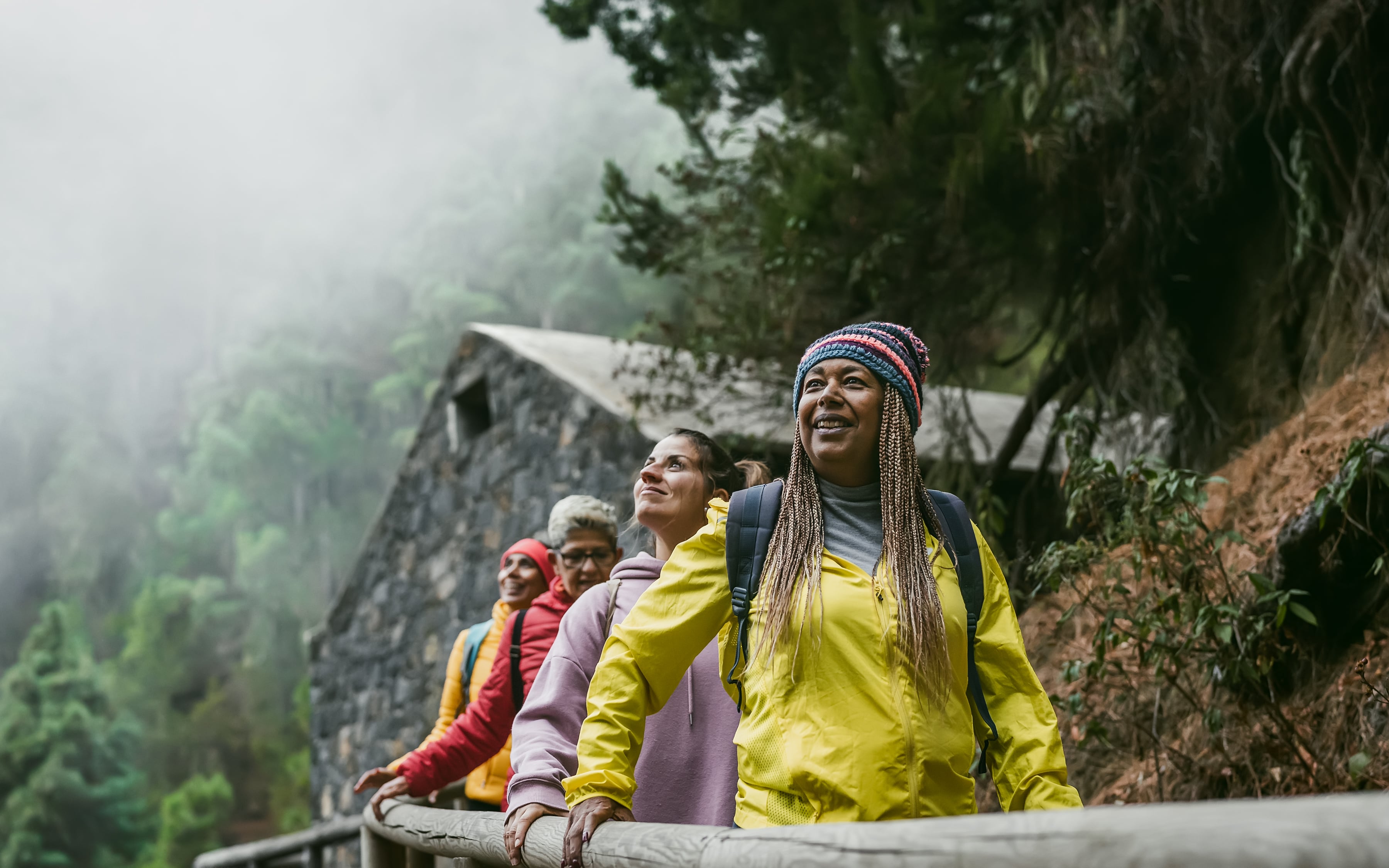 A group of older female travellings heading through a misty landscape in Spain