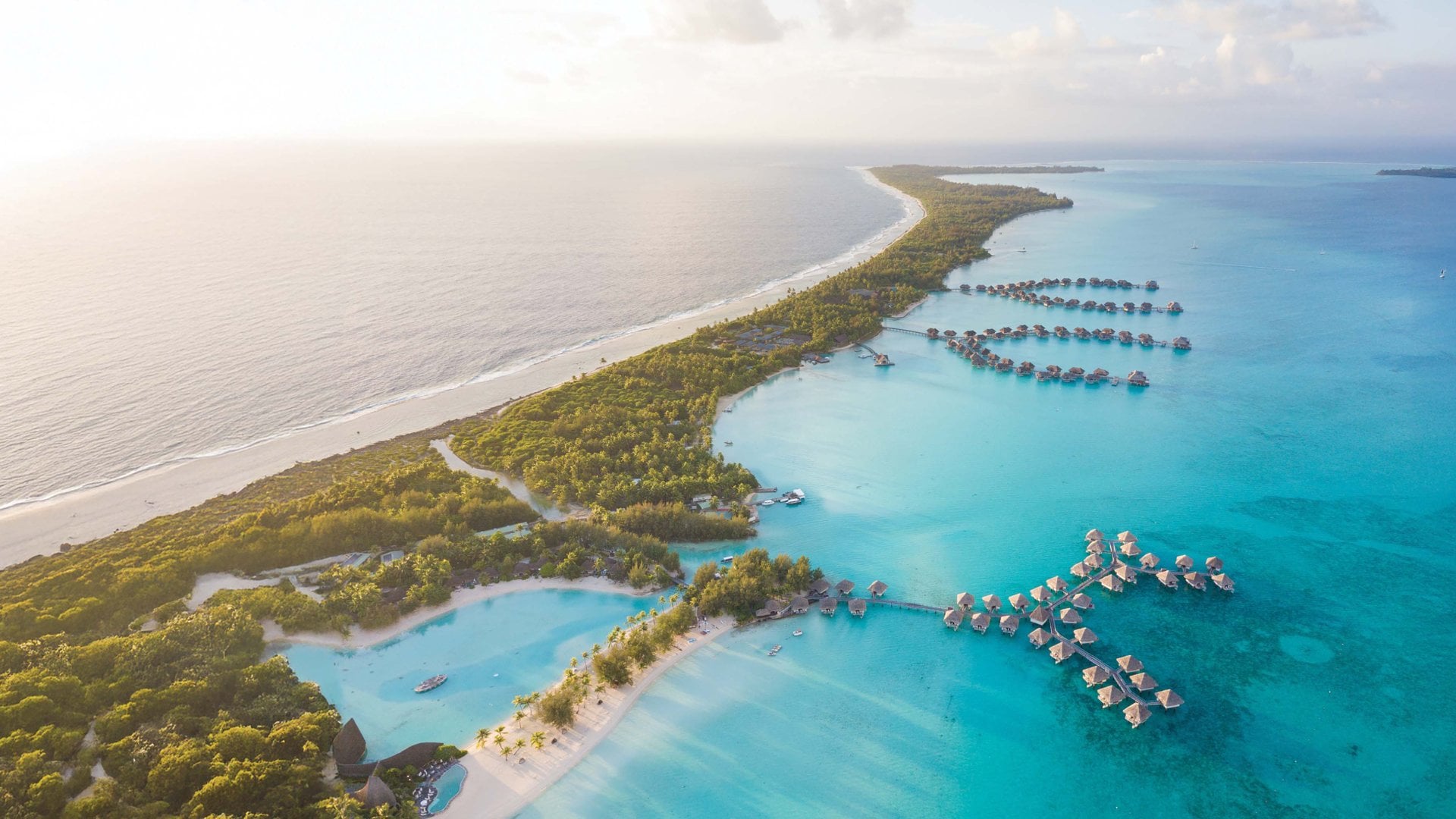 An aerial view of overwater bungalows in Bora Bora, French Polynesia.