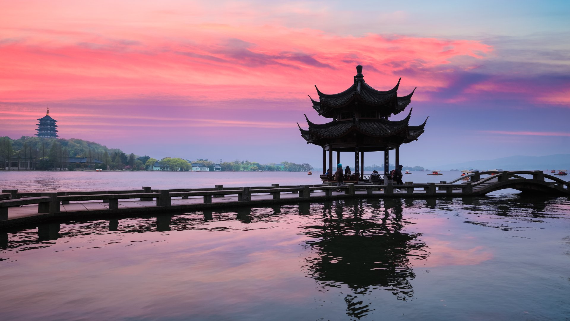 Hangzhou, China Ancient Pavilion Silhouette at Sunset on the West Lake in Hangzhou, China