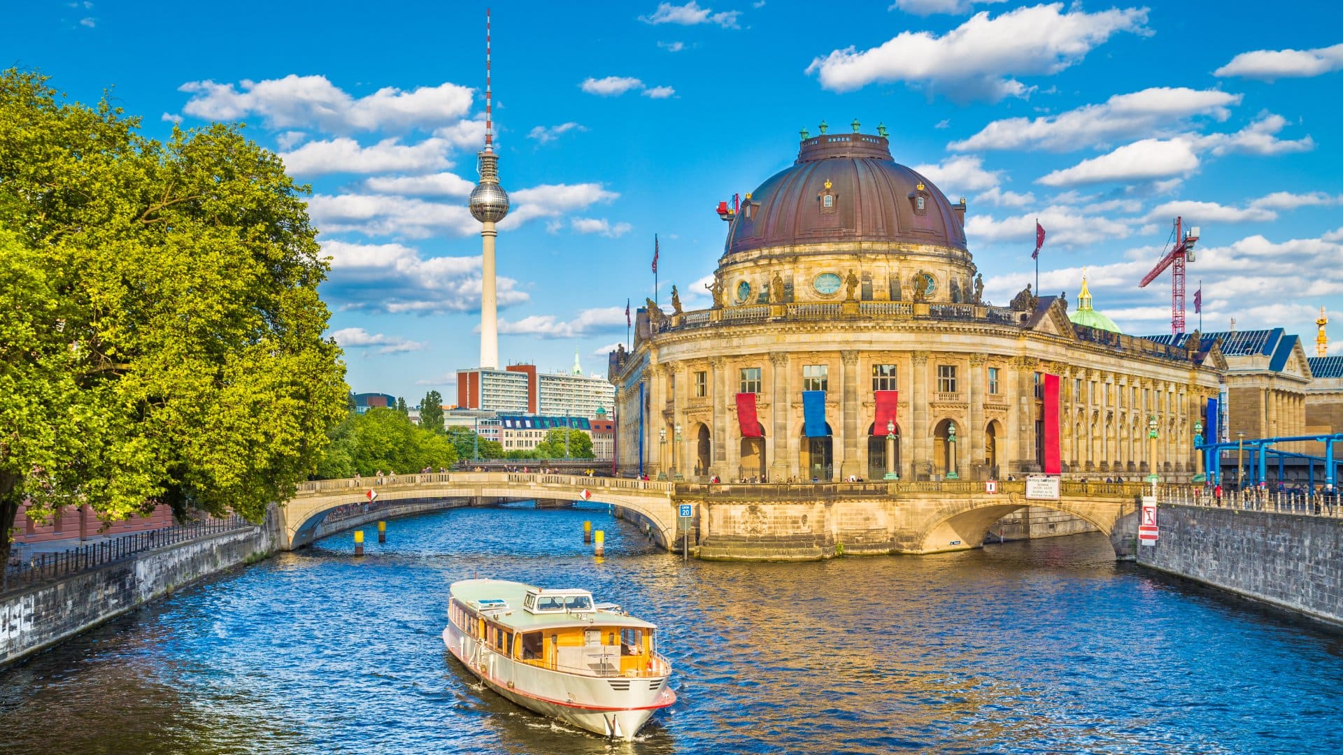 Germany Beautiful view of UNESCO World Heritage Site Museumsinsel (Museum Island) with excursion boat on Spree river, Berlin, Germany
