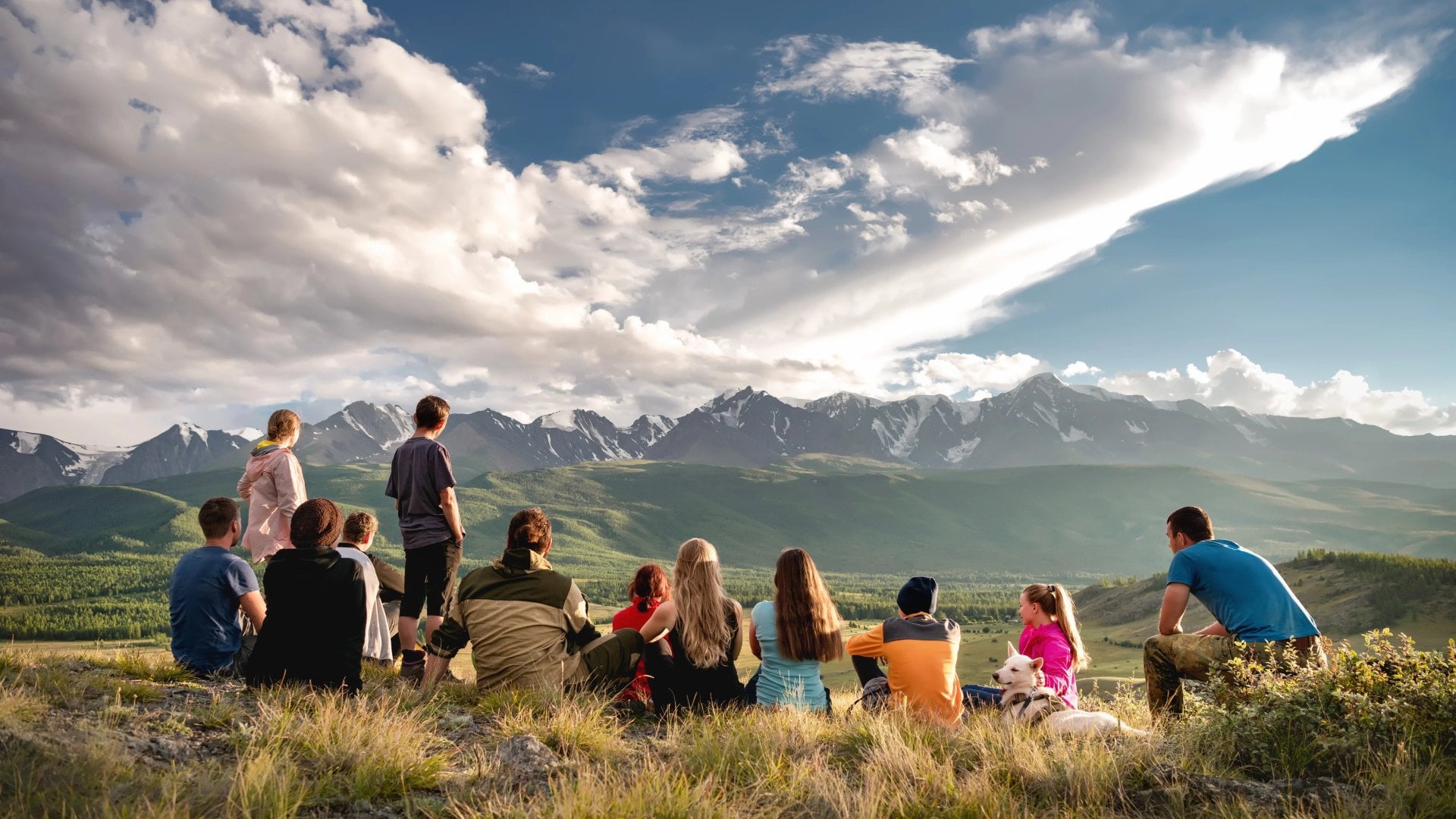 Big group of tourists are sitting in mountains