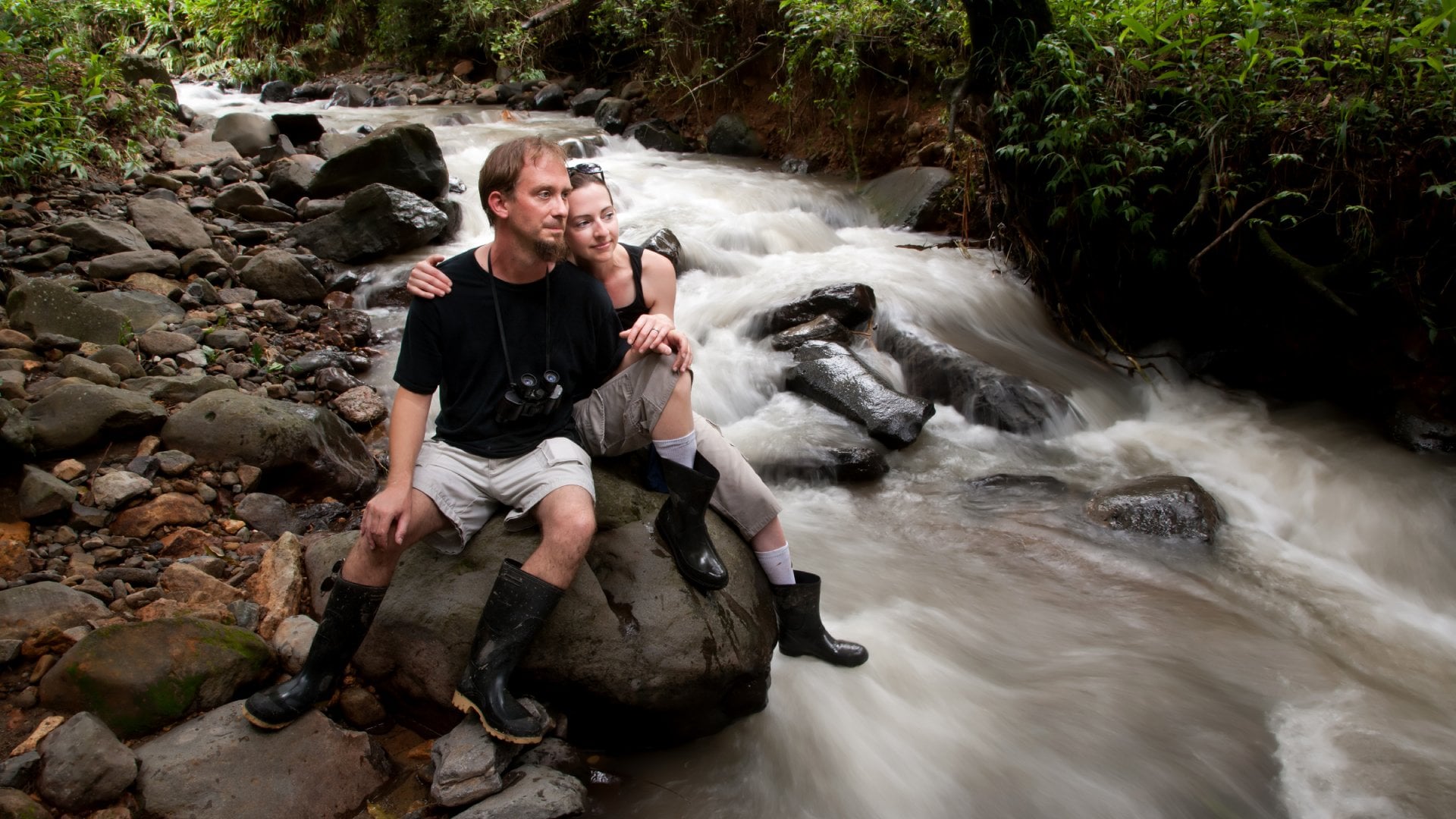 Couple Relaxing Near River, Costa Rica