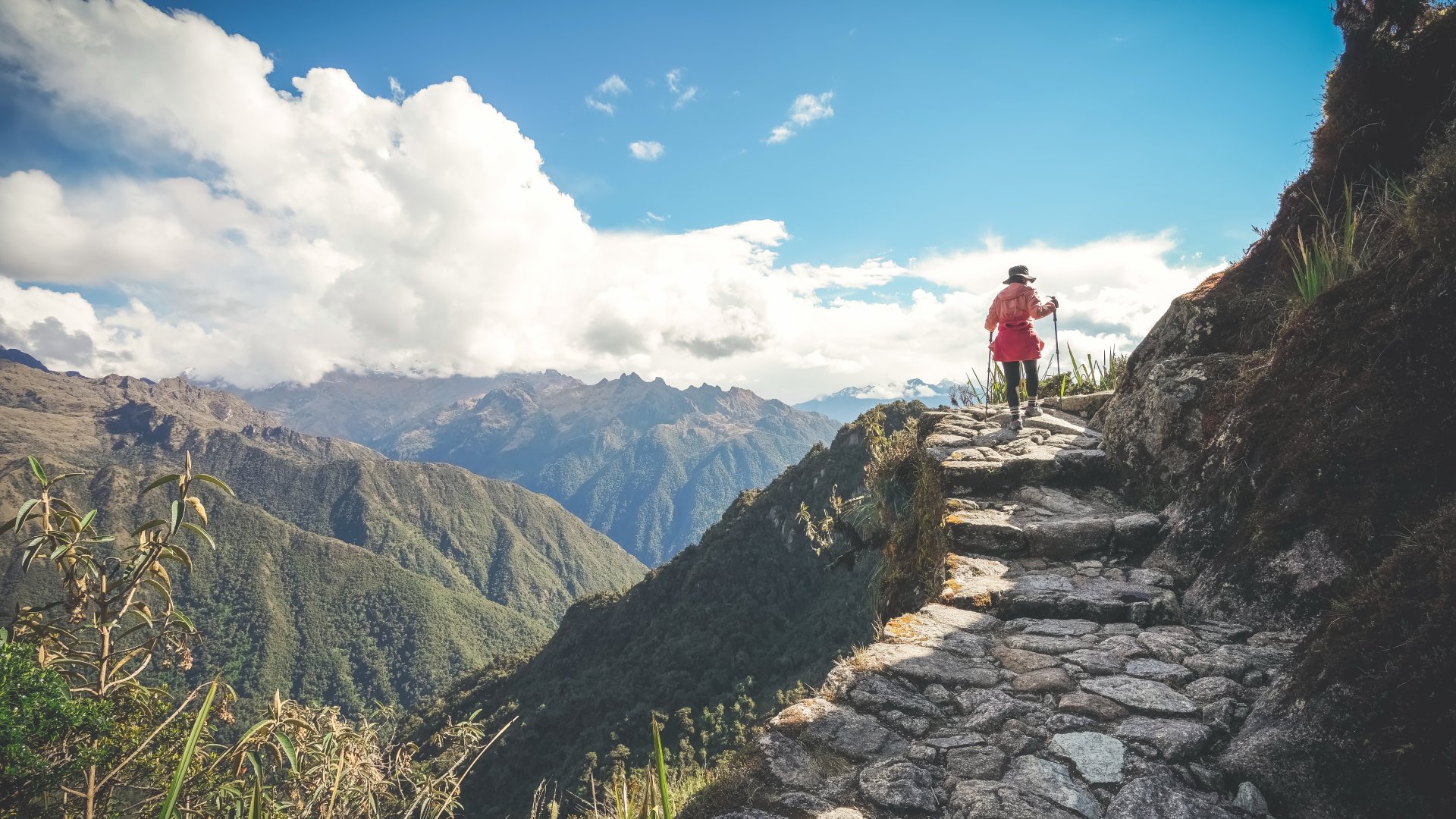 Sacred Valley of the Incas, Peru Female hiker walking towards Machu Picchu on the famous Inca Trail, Sacred Valley, Peru