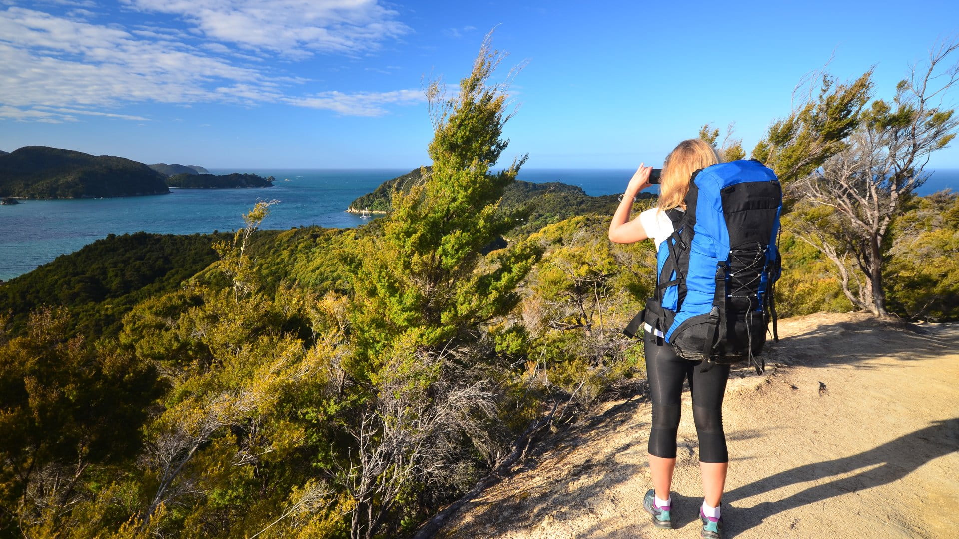 Abel Tasman National Park Hiker taking picture in Abel Tasman National Park