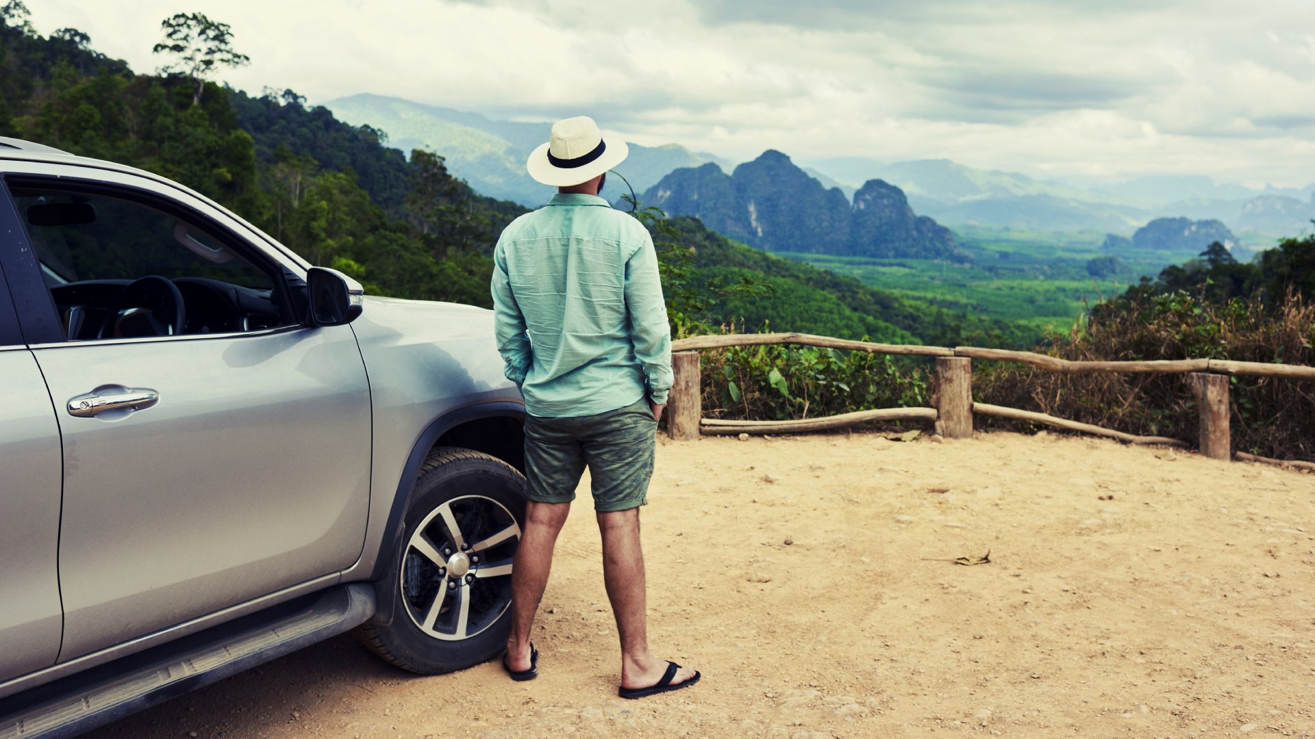 Thailand Male Traveller with SUV Admiring Landscape in Thailand