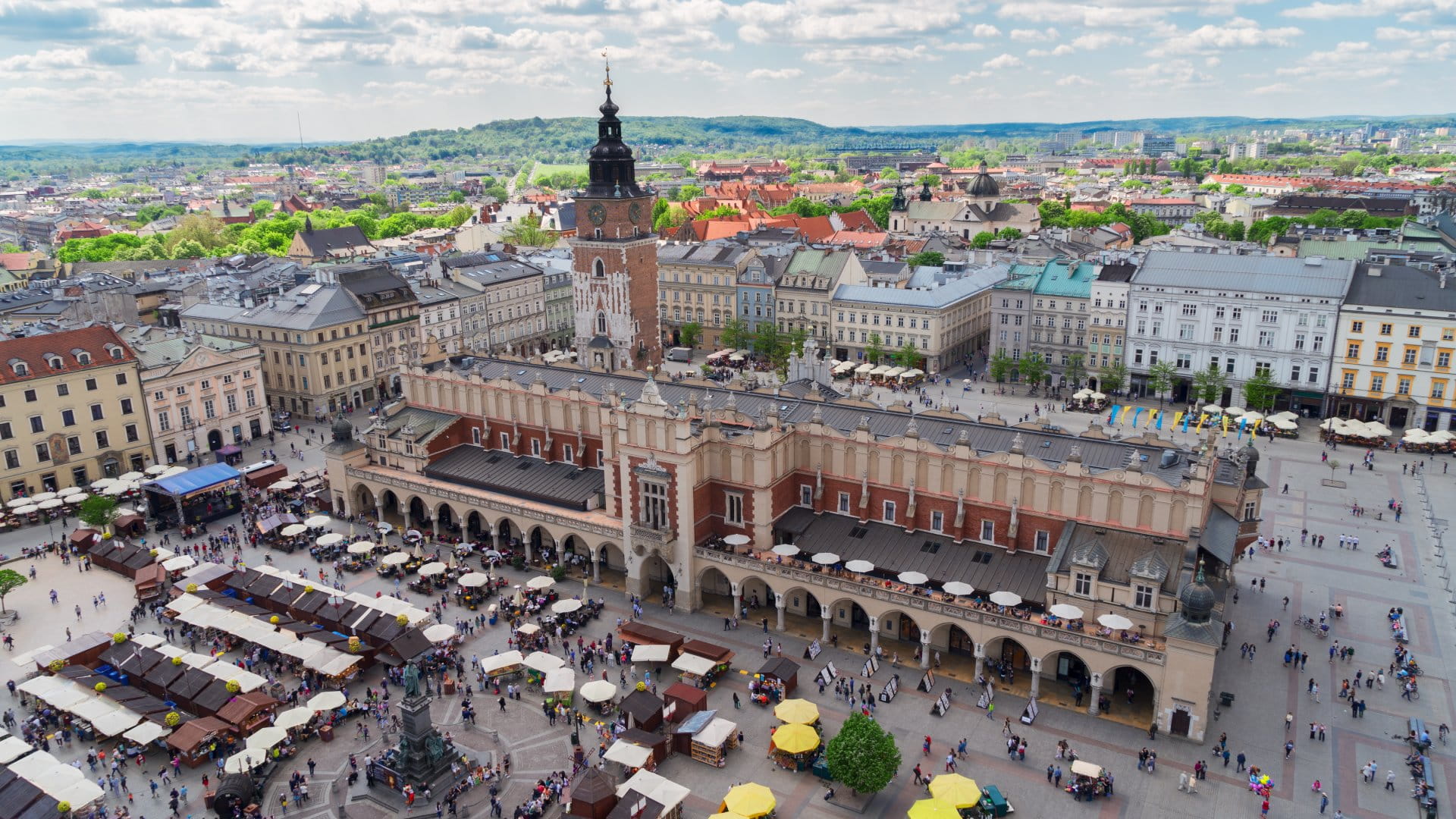 Market Square with Cloth Hall and City Hall Tower in Krakow, Poland Trip
