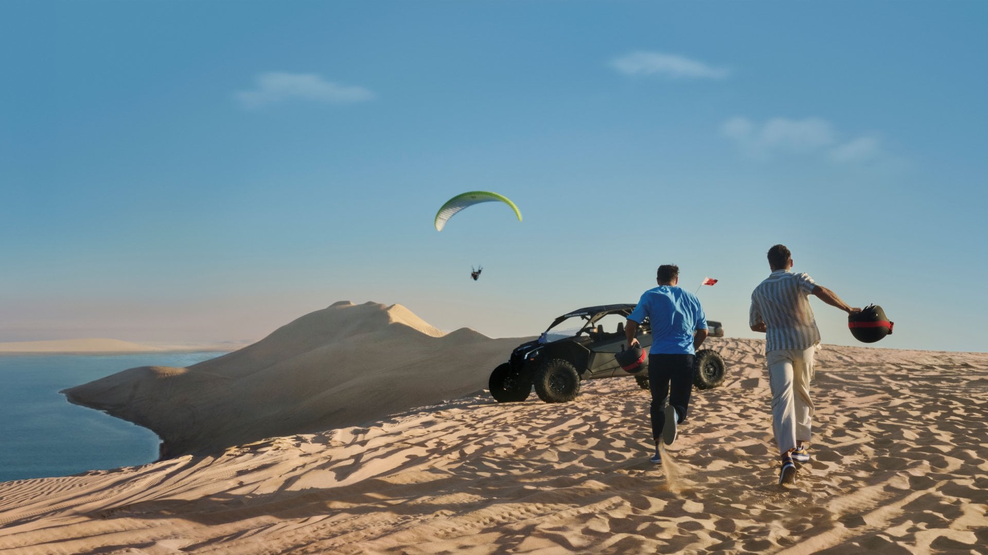 Inland Sea, Qatar People running across dunes in the Inland Sea.