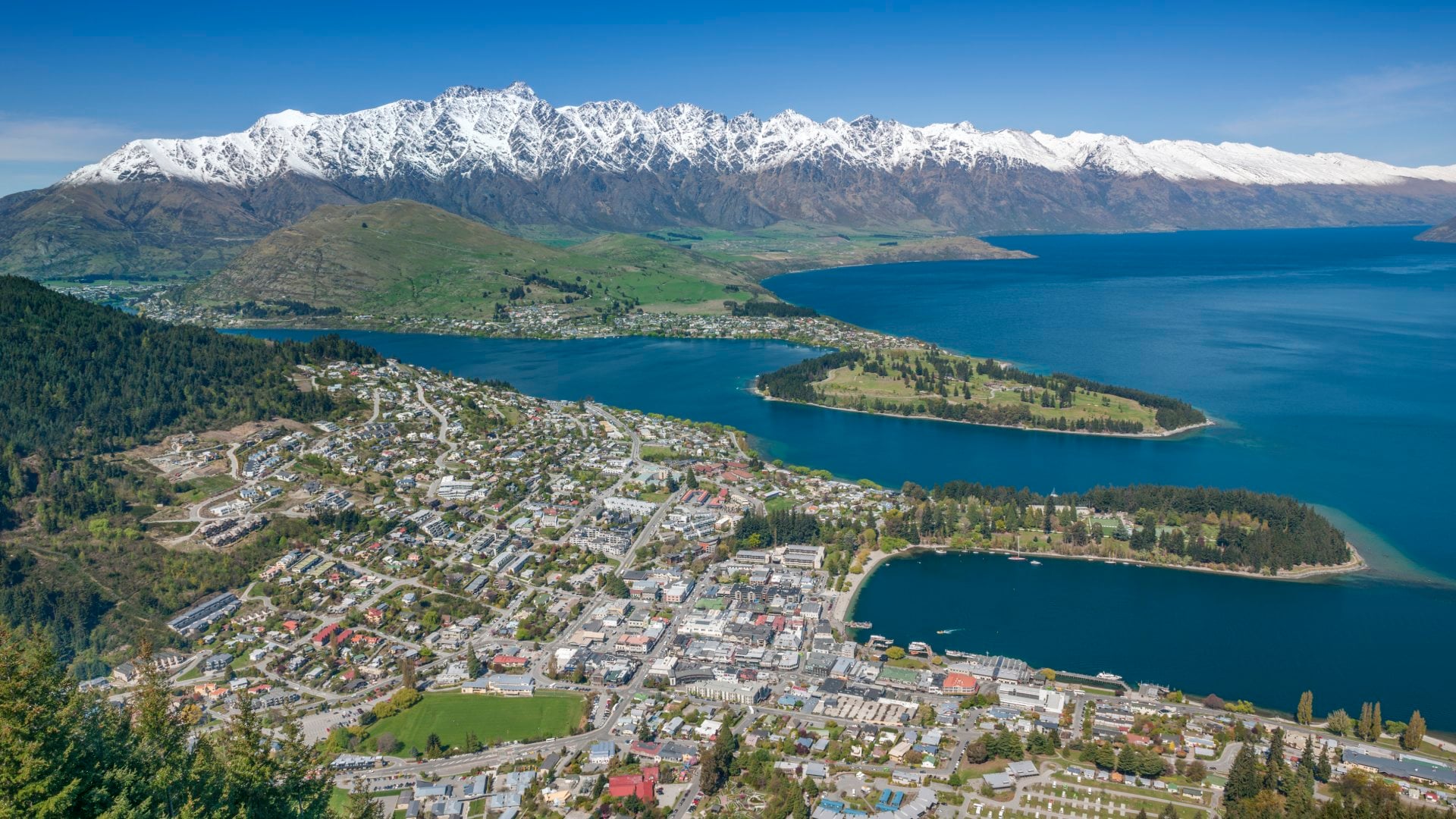 Queenstown and The Remarkables Panorama, Otago, New Zealand. Spring has just started and the peaks of the Remarkables in back got their last powder snow.
