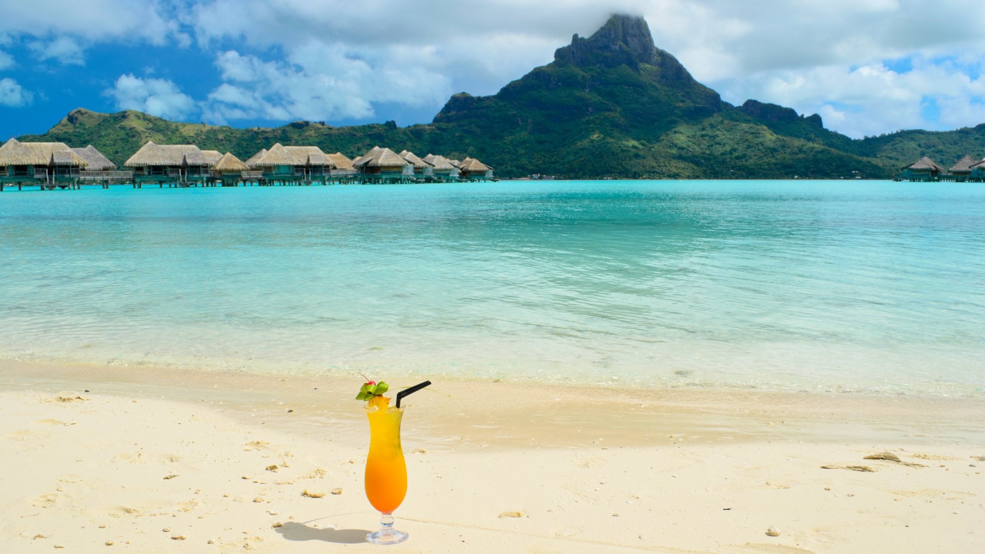 Tahiti, French Polynesia Sex on the Beach cocktail on beach of resort with view of Bora Bora in Tahiti (French Polynesia)
