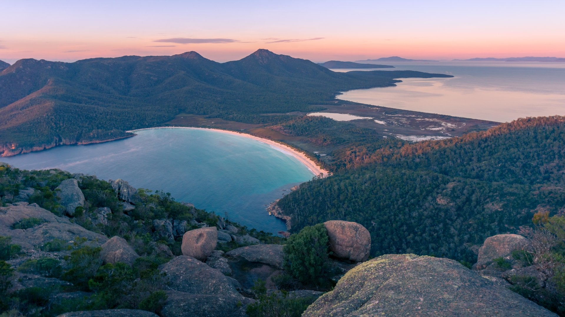 Sunrise landscape of beautiful bay and mountains. Wineglass bay in Freycinet National Park, Tasmania, Australia