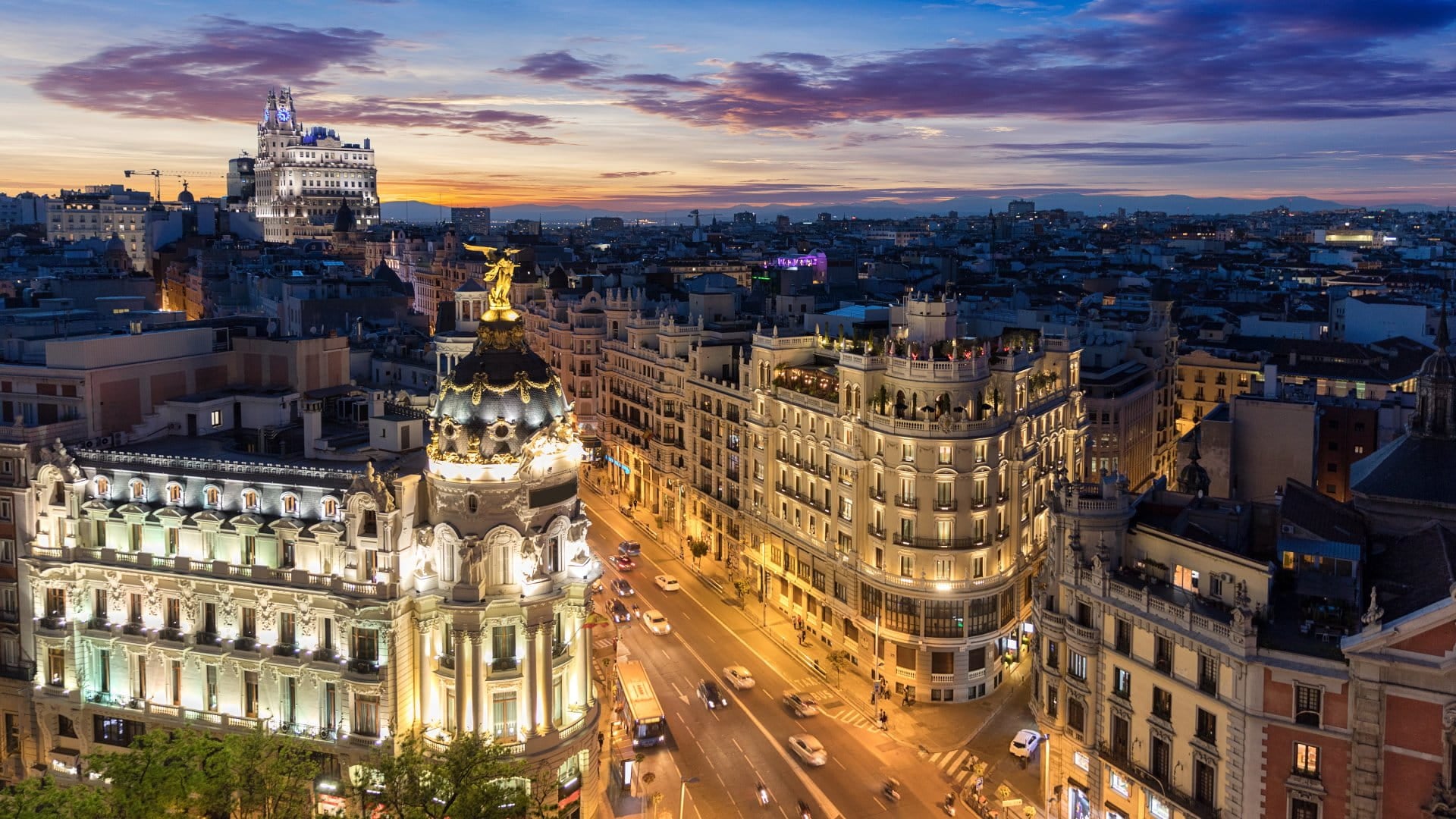 Madrid, Spain View of the Metropolis Building and Gran Via from Circulo de Bellas Artes rooftop at sunset, Madrid, Spain