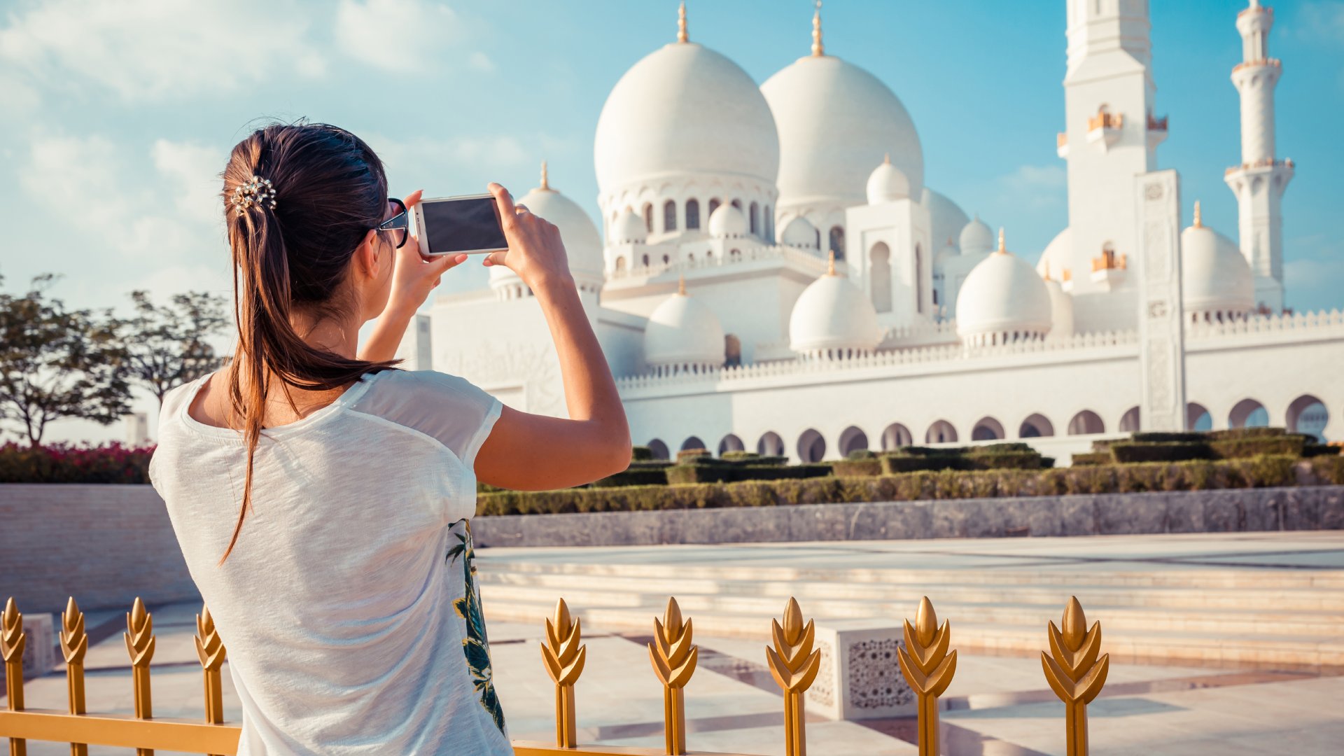Woman Photographing Sheikh Zayed Grand Mosque, Abu Dhabi, United Arab Emirates (UAE)
