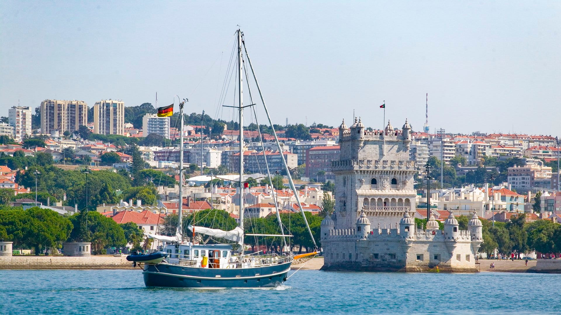 Yacht passing Belem Tower in Belem district, Lisbon, Portugal