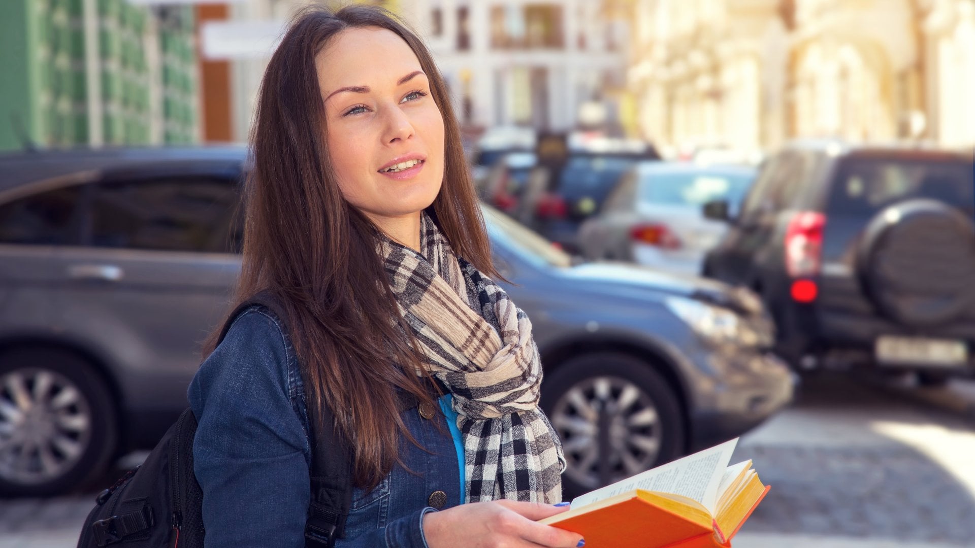 Young female traveller learning foreign languages in a different country.