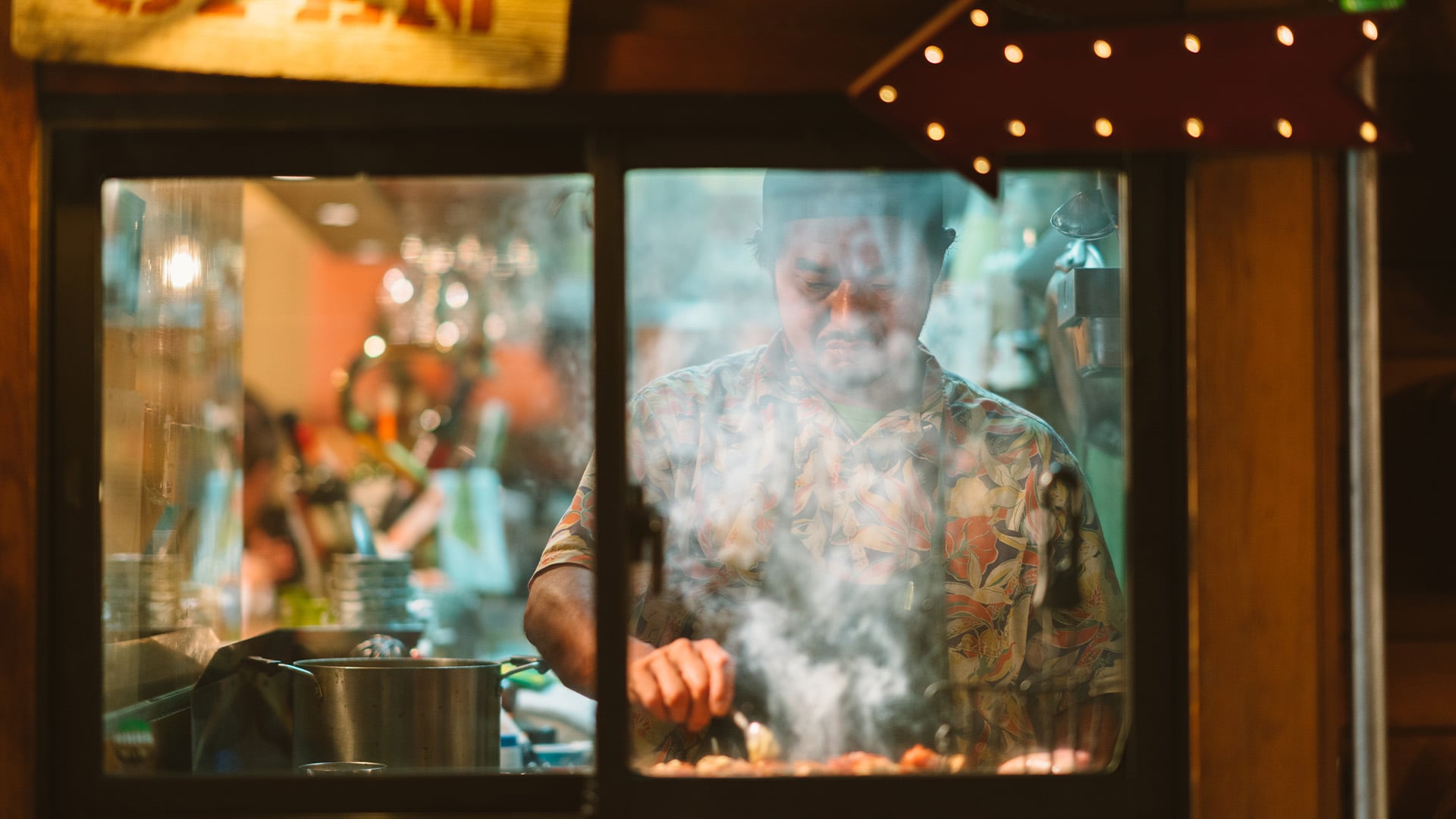 A chef smokes some yakitori in a restaurant in Tokyo, Japan.