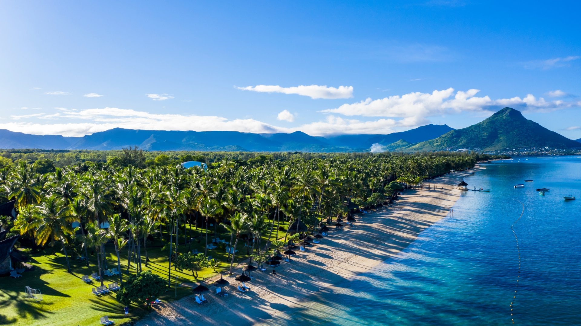 Flic en Flac, Mauritius Aerial view of beach and forest with mountain backdrop in Mauritius