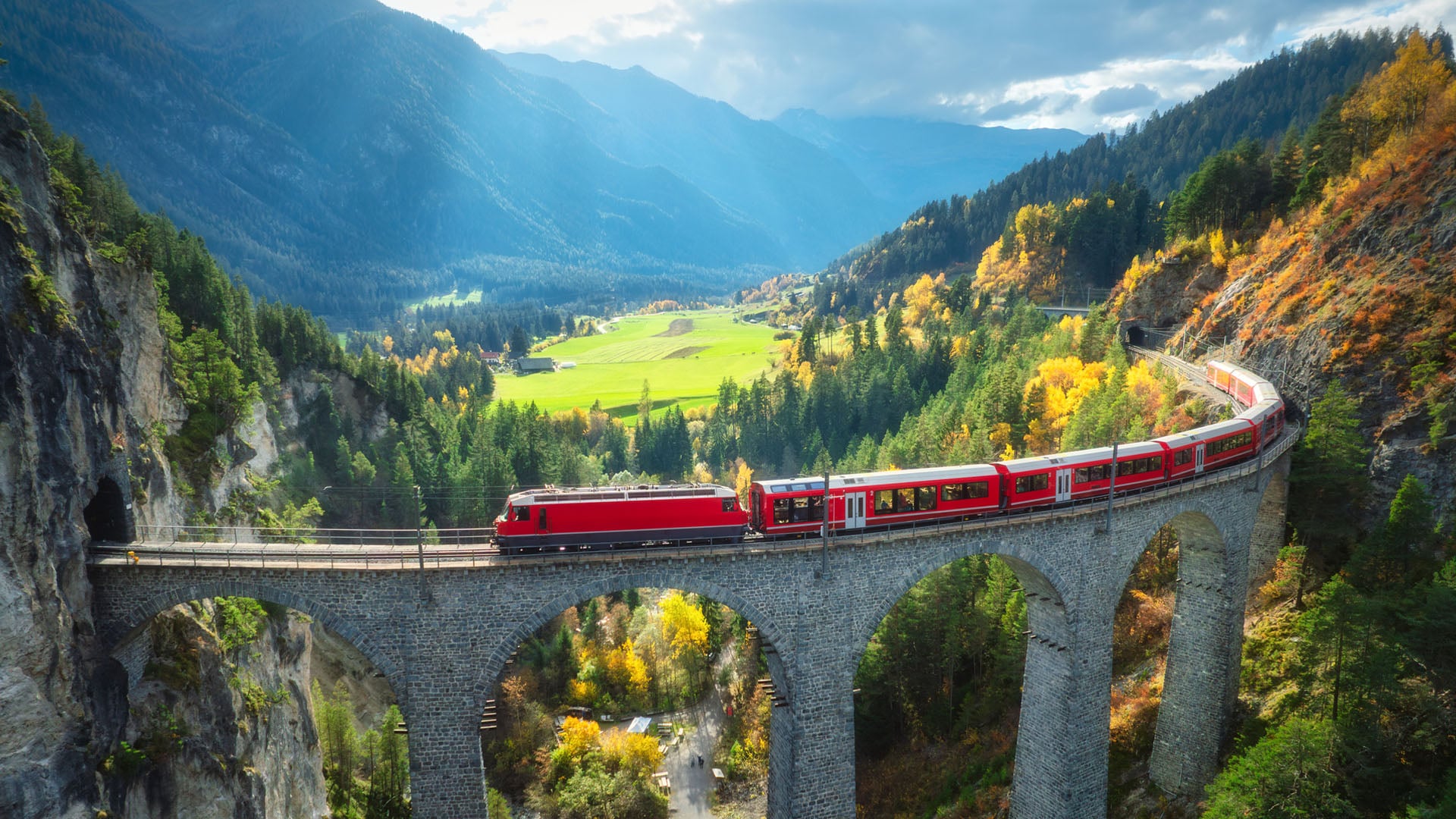 Landwasser Viaduct, Switzerland A red train passes over the Landwasser Viaduct in Switzerland in the summer