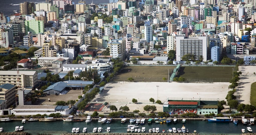 Aerial shot of the Maldivian capital of Male - typically the starting point of your Maldives vacation.