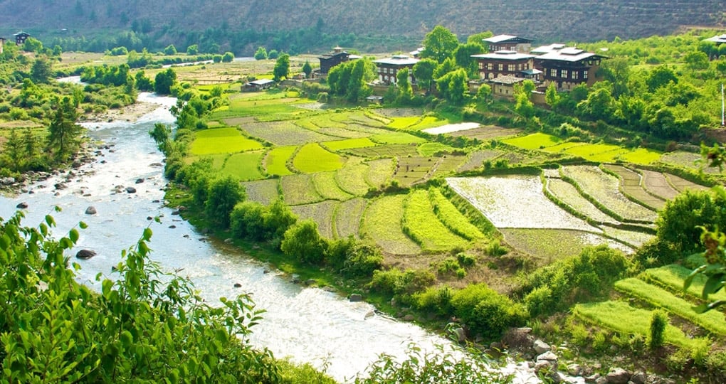 Bhutanese houses in the Paro valley are a great photo opportunity on Bhutan tours.