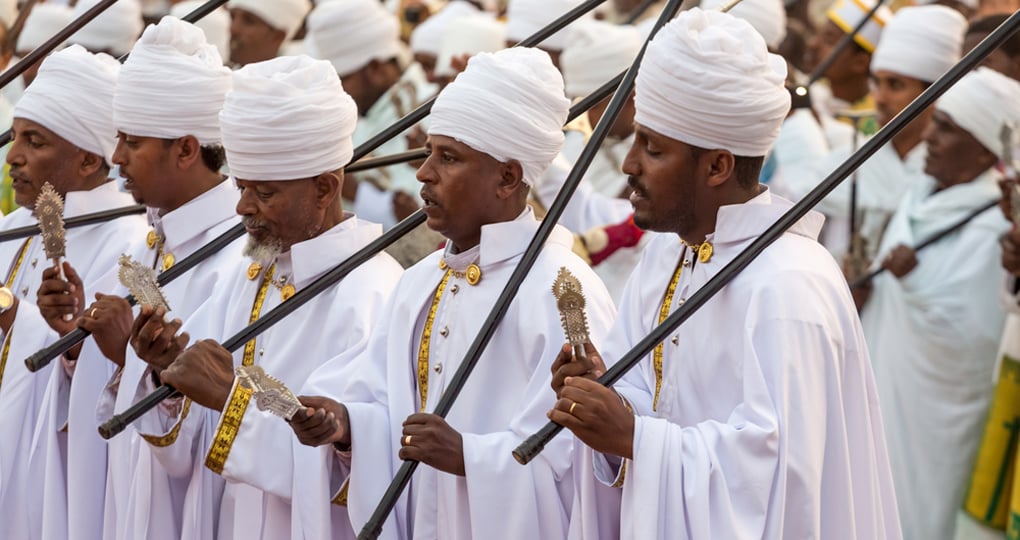 Clergymen sing and chant while accompanying the Tabot Clergymen sing and chant while accompanying the Tabot