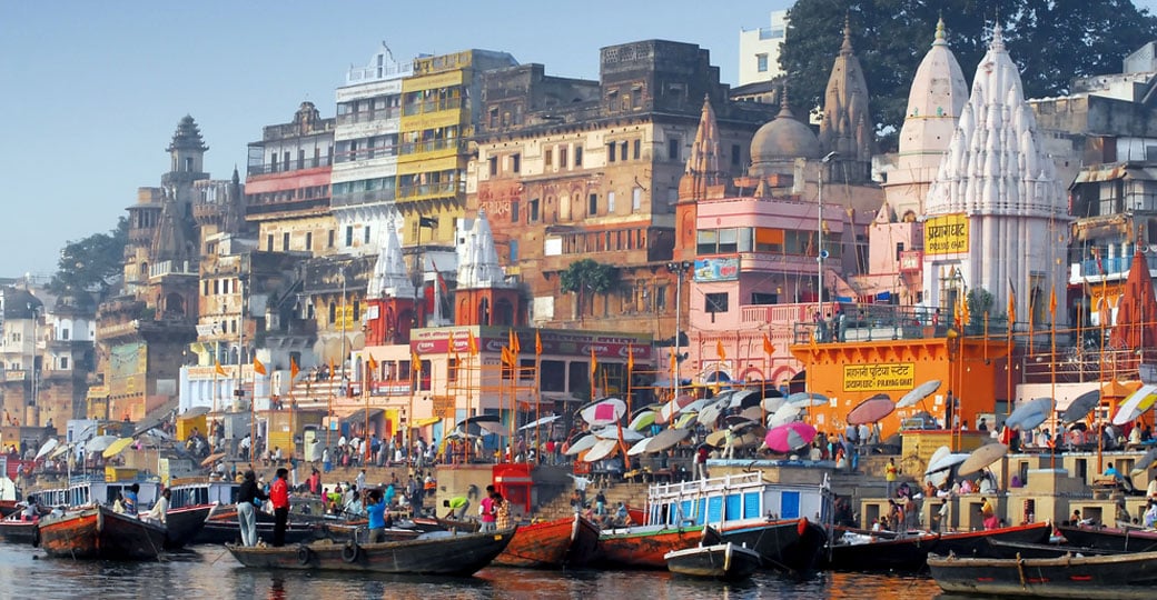 The colorful main ghat is a major attraction on all India vacations. The colorful main ghat is a major attraction on all India vacations.