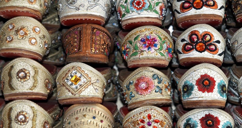 Rack of traditional Indian shoes made of camel skins Rack of traditional Indian shoes made of camel skins