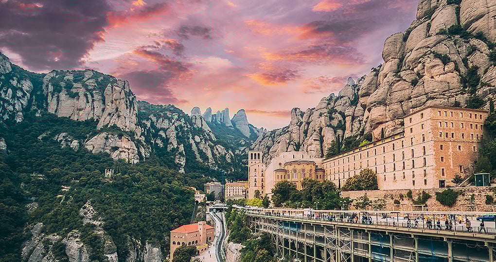 Take a day trip out of Barcelona to stop at Santa Maria de Montserrat, a stunning cliffside Monastery
