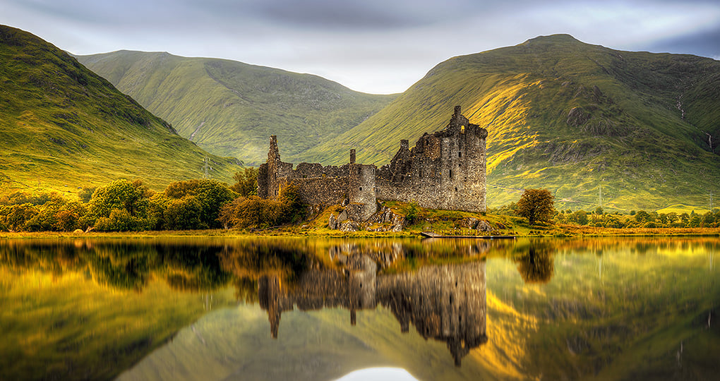 Experience awe while admiring the lightning struck Kilchurn Castle situated on Loch Awe Experience awe while admiring the lightning struck Kilchurn Castle situated on Loch Awe