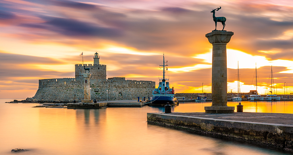 Stroll the waterfront at Mandraki Harbour, believed to be the site of the great statue of Colossus, one of the Seven Wonders of the Ancient World Stroll the waterfront at Mandraki Harbour, believed to be the site of the great statue of Colossus, one of the Seven Wonders of the Ancient World
