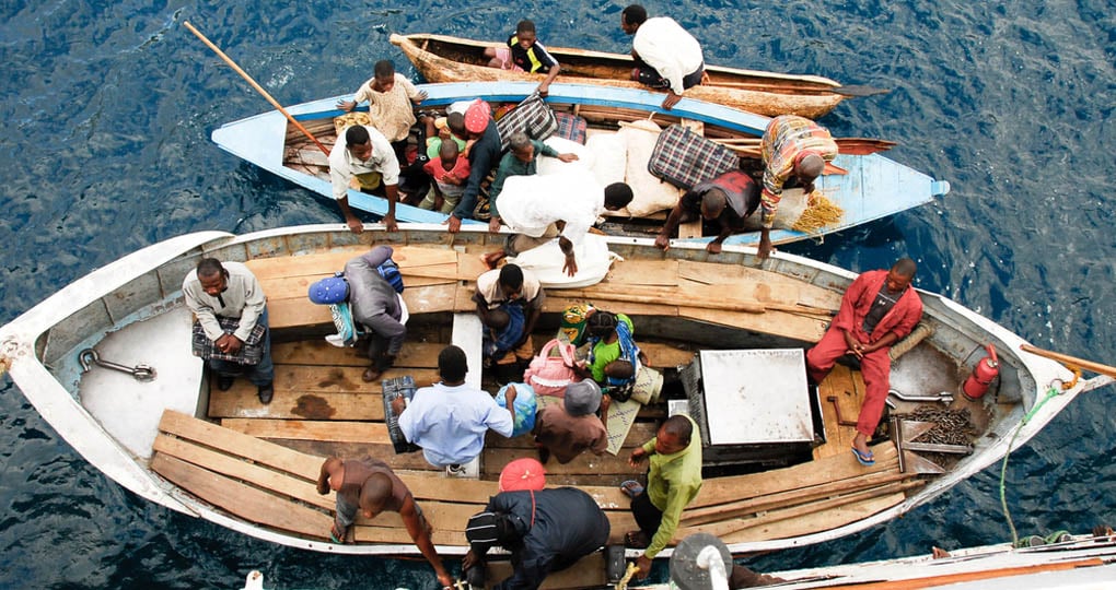 Locals prepare to embark on a ferry - a change for you to see the daily activities of Malawi life while on Lake Malawi tours. Locals prepare to embark on a ferry - a change for you to see the daily activities of Malawi life while on Lake Malawi tours.