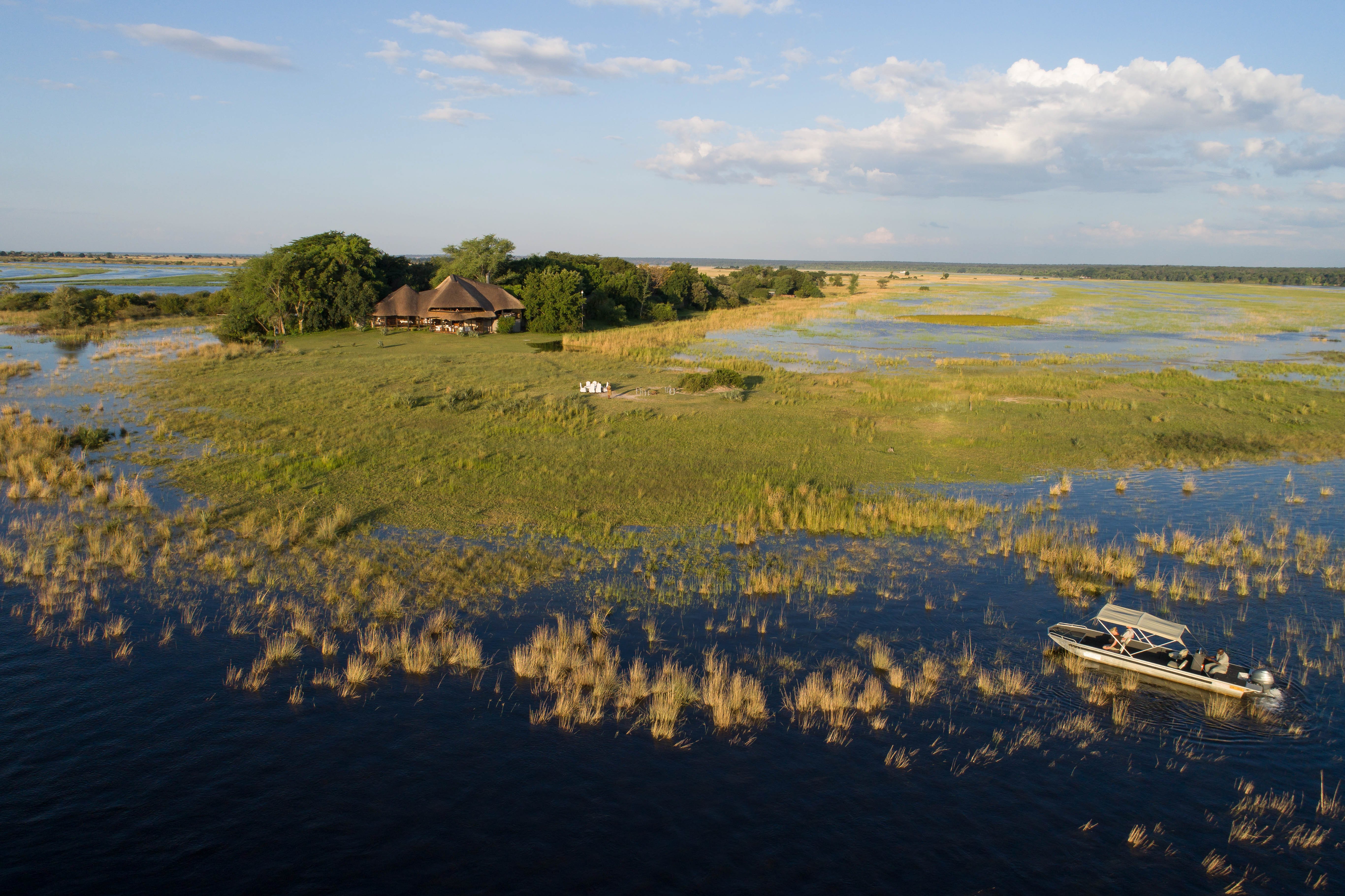 Two mokoro (canoes) pass through the waters of the Okavango Delta in Botswana.