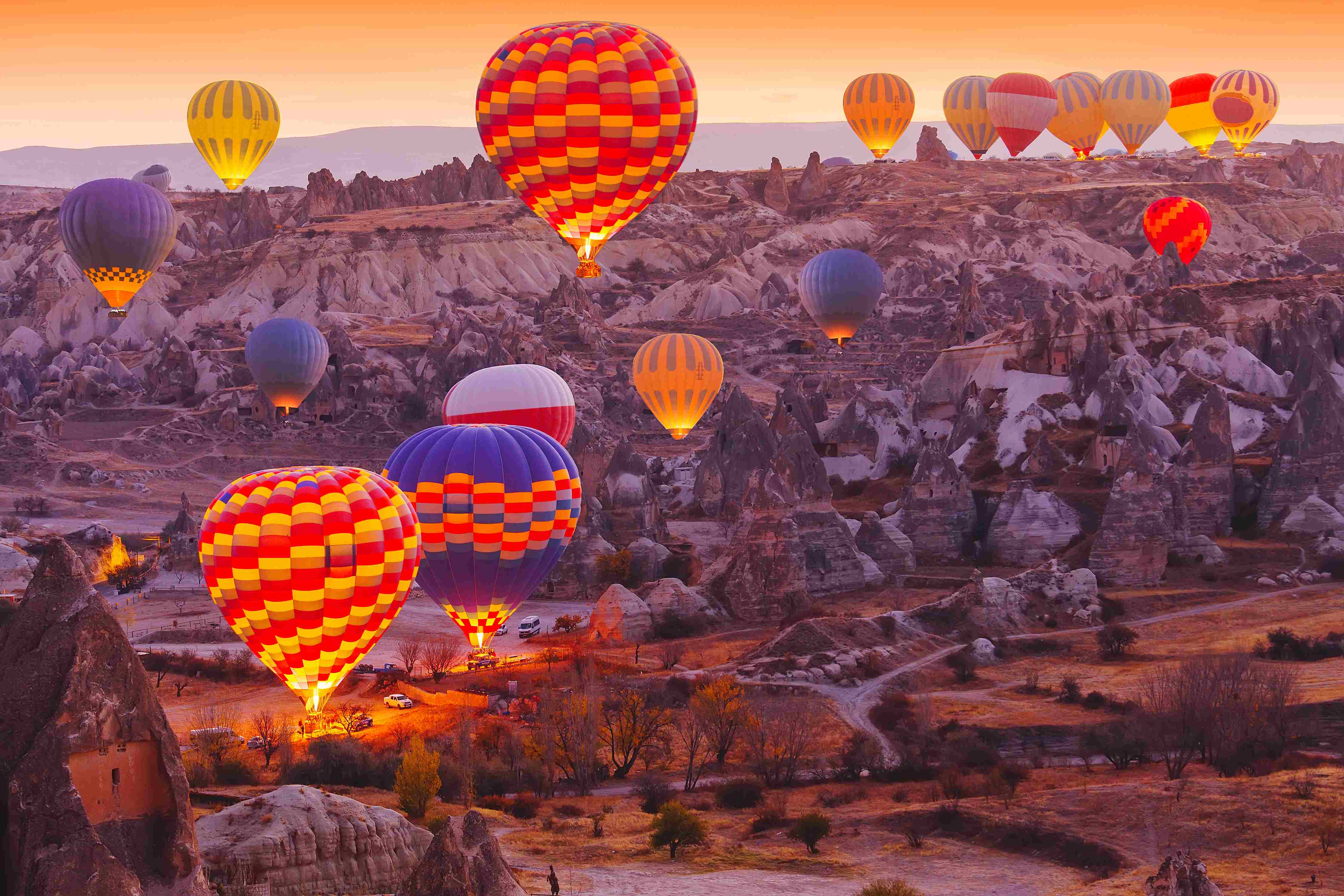 Scenic vibrant view of balloons in flight in Cappadocia Valley