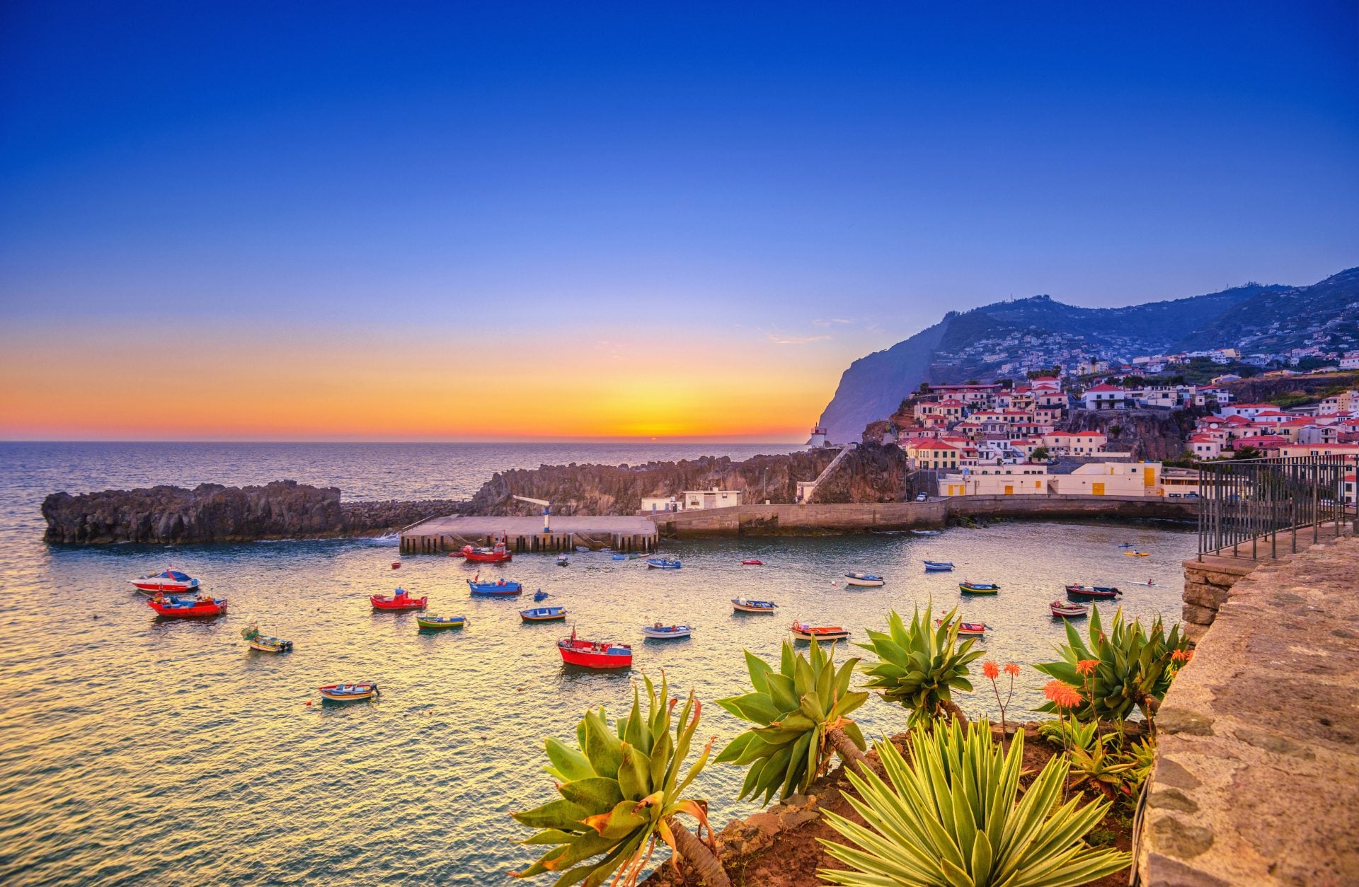 Camara de Lobos, Funchal, Madeira The beautiful fishing village, boats in the water and steep cliff in the background