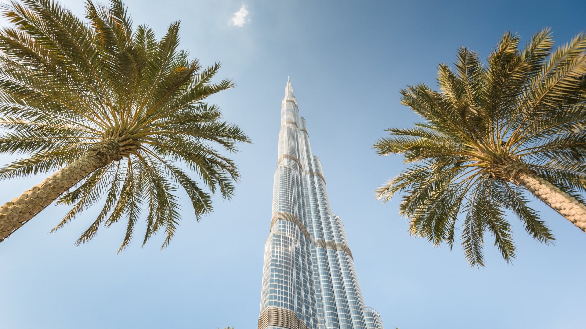 Low angle view of the Burj Khalifa in the city of Dubai on downtown dubai district. the Burj Khalifa tower is the tallest building in the middle east. Sunny day.