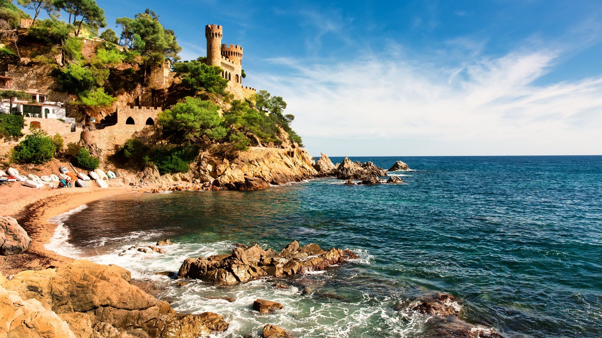 Medieval castle overlooking balearic coast and stunning beach