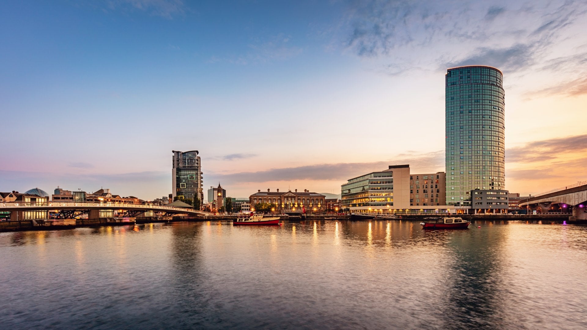 Panorama of Belfast River Lagan Waterfront Cityscape and Lagan Bridge at Sunset Twilight