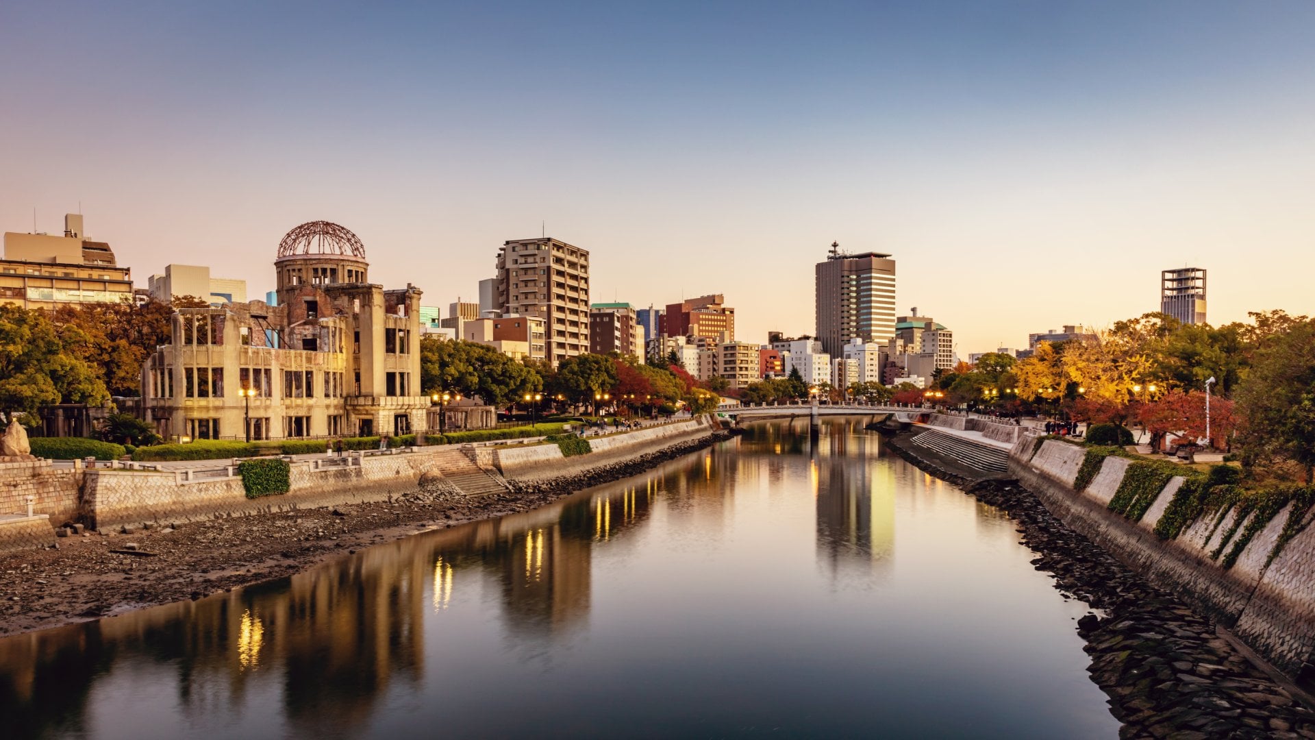 Panorama of Hiroshima Cityscape at Twilight. View over the Ota River, Atomic Bomb Dome illuminated on the left side of the river
