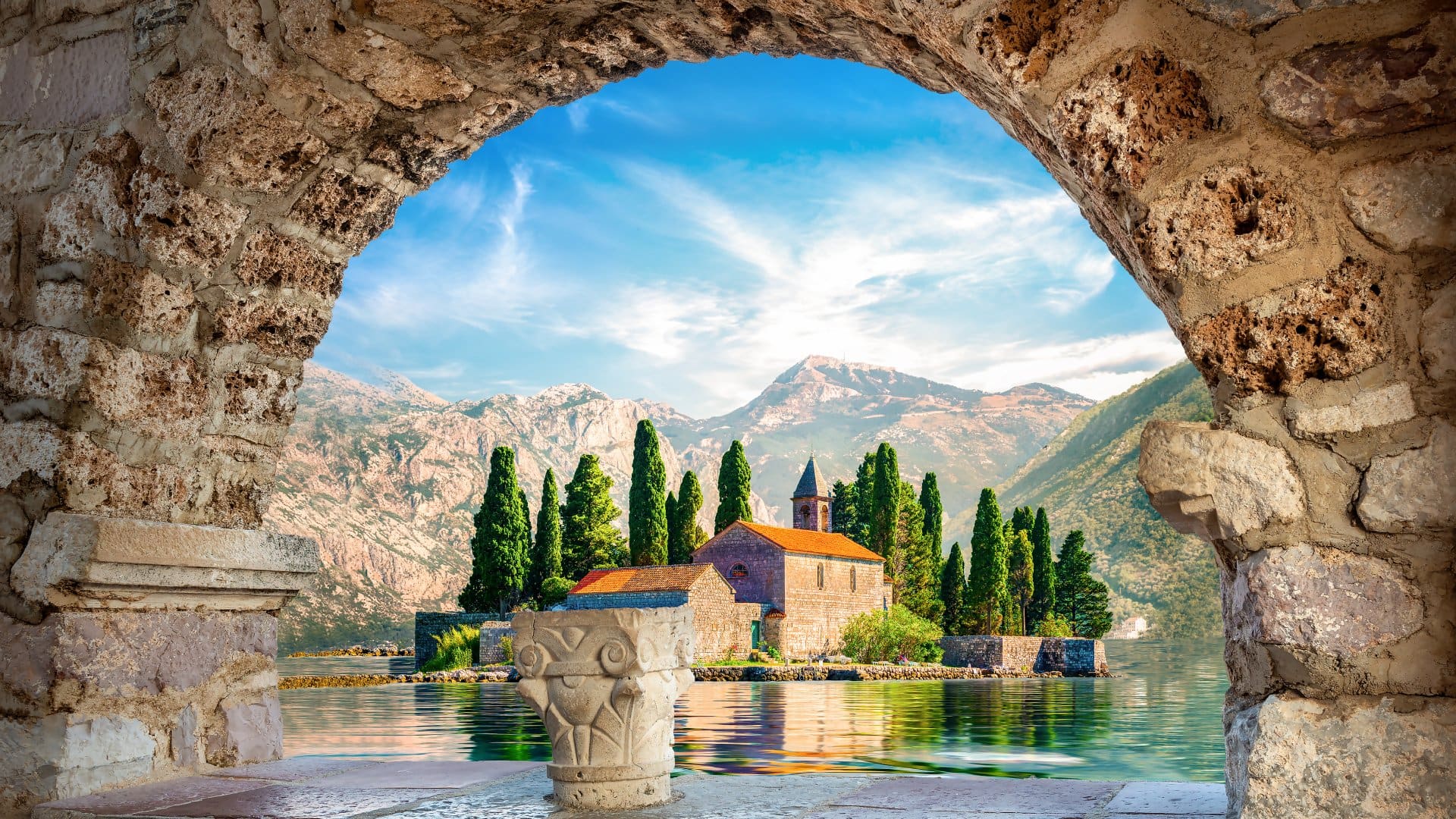 View on St George island from Our Lady of the Rocks through arch