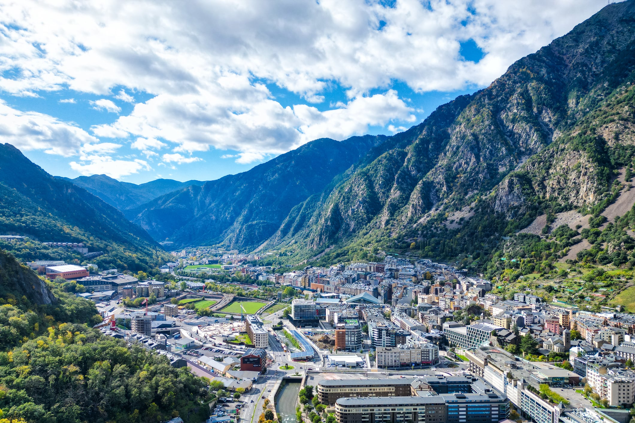 Expansive aerial view revealing the dense urban landscape nestled among the mountains of Andorra