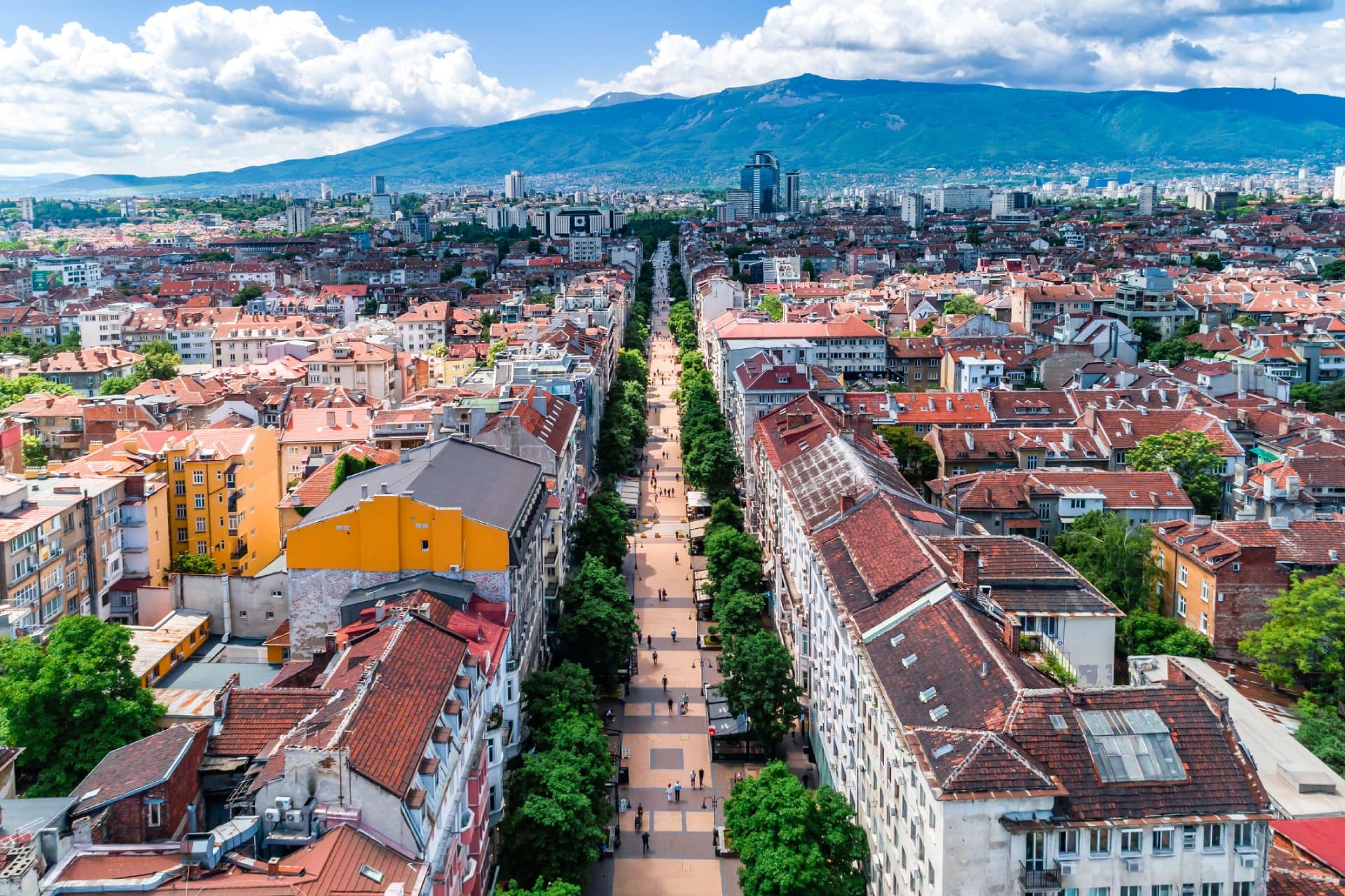 Wide aerial drone shot of Sofia city, Bulgaria Vitosha street