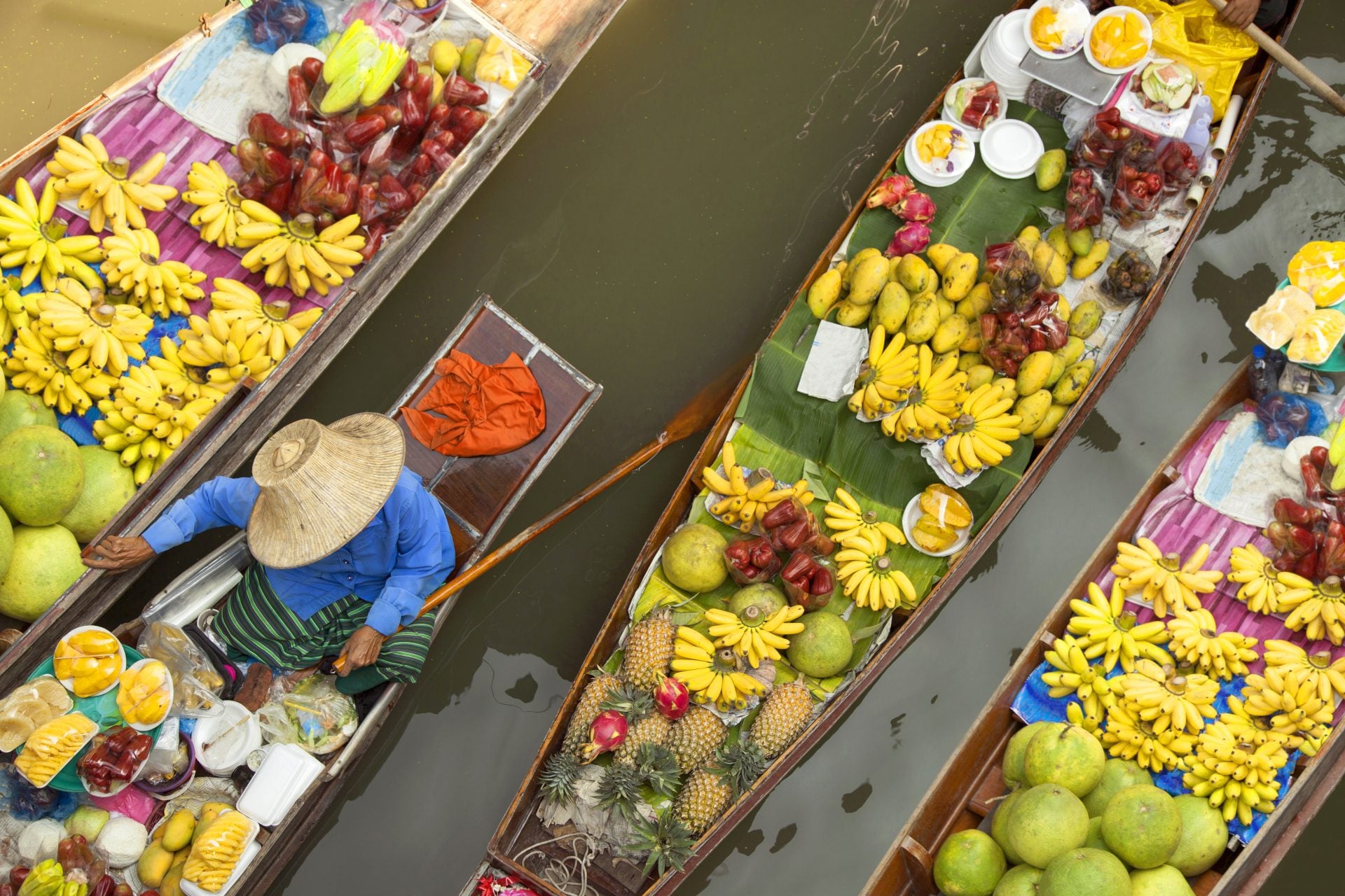 Bangkok Floating market, boats filled with fruits and vegetables, in Bangkok, Thailand