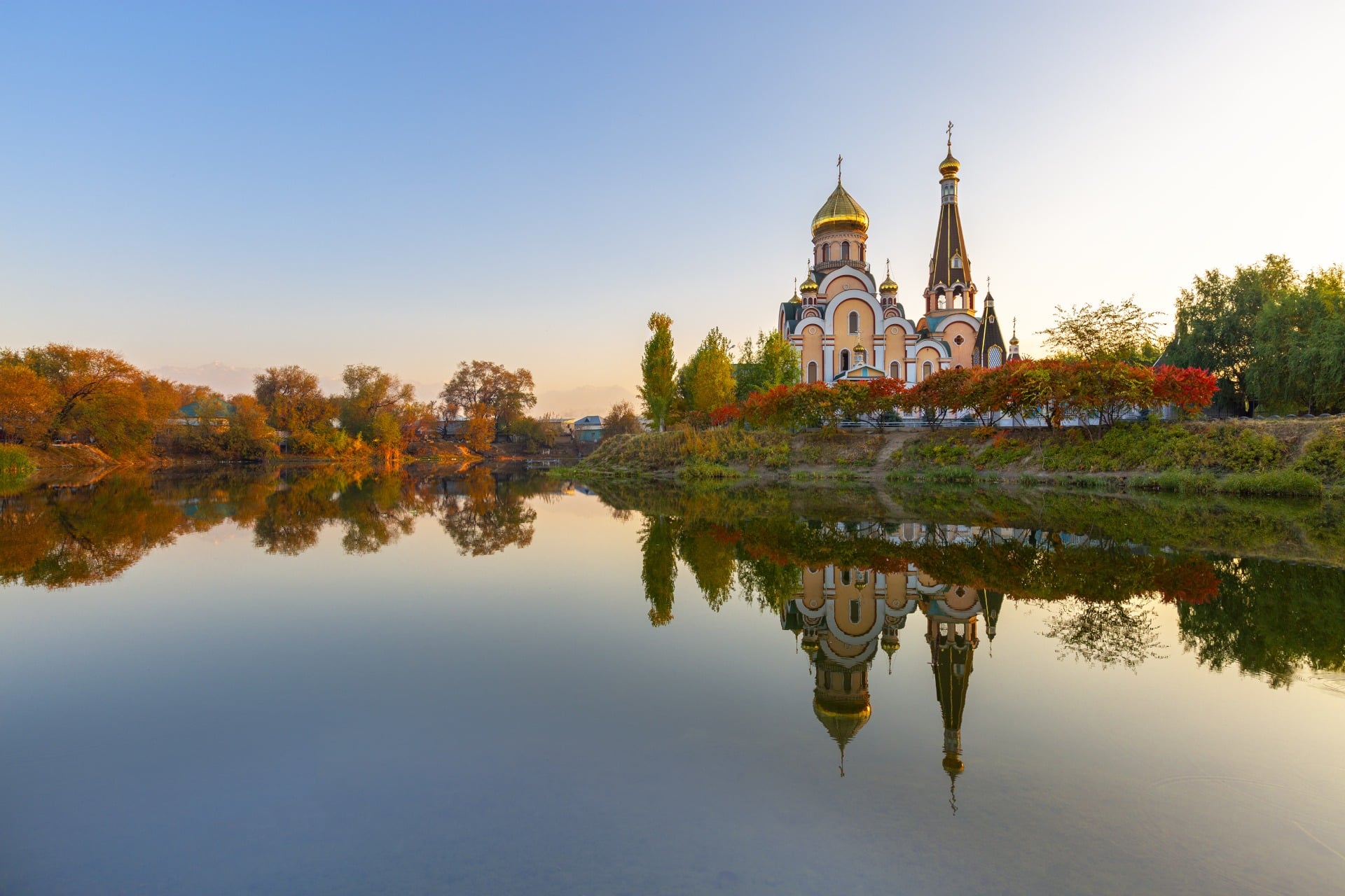 Russian orthodox church and its reflection, at the sunset in Almaty, Kazakhstan