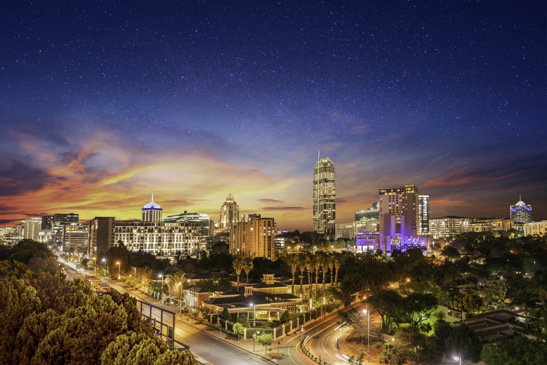 Sandton city at night with twilight and stars in the sky, Gauteng Johannesburg