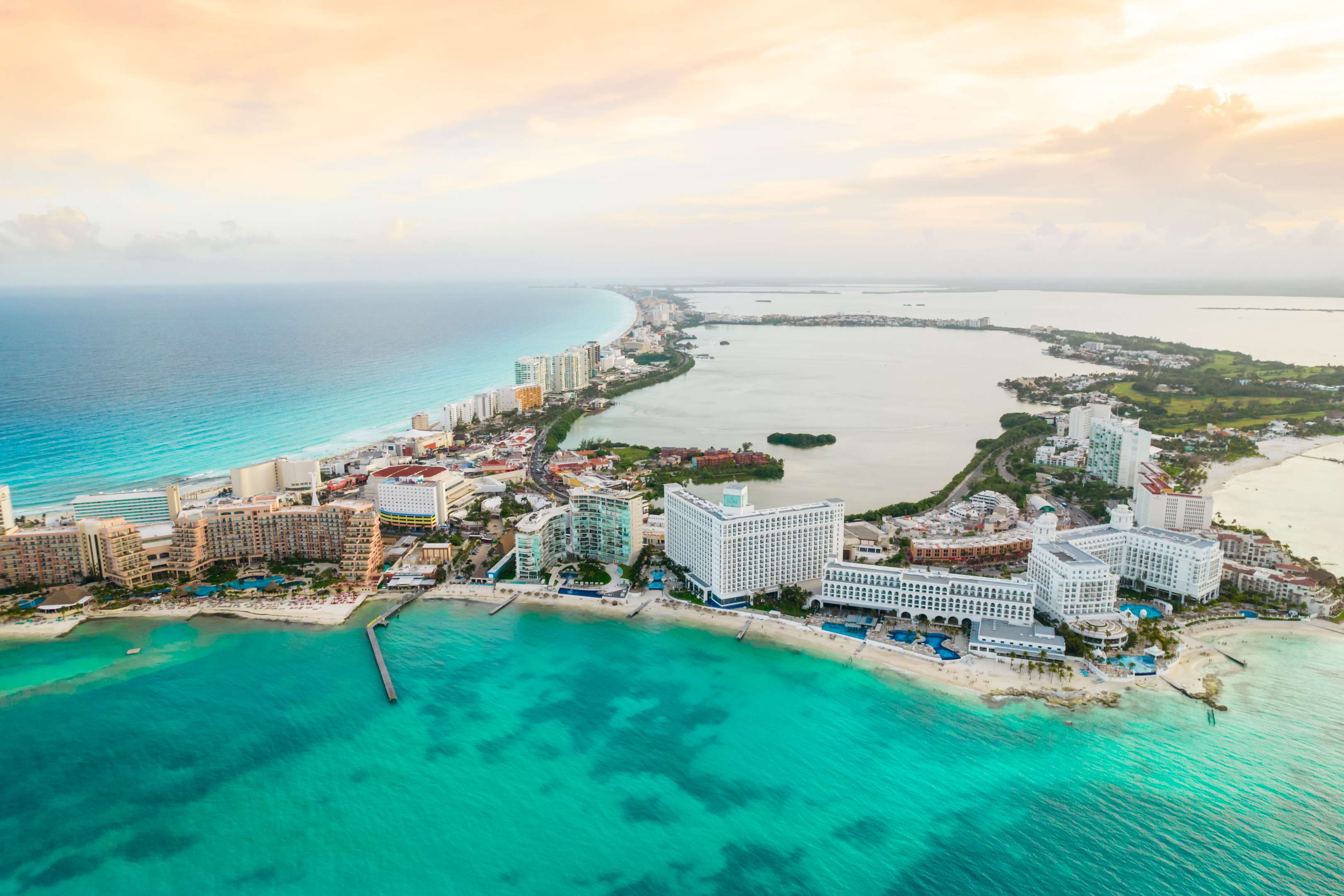 Aerial view of Cancuns turquoise waters and powdery white sandy beaches, stretching for 23 kilometres and shaped like the number seven
