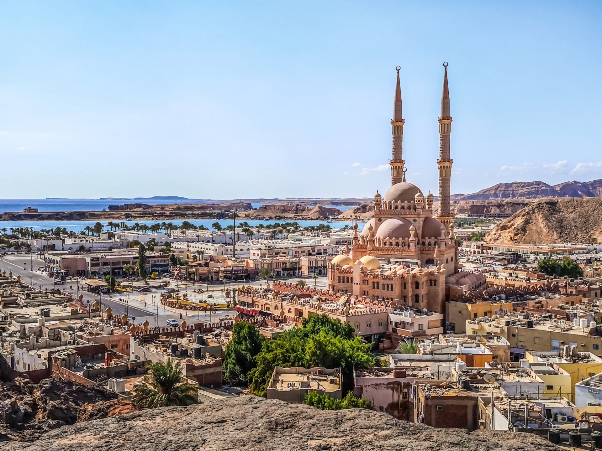 Top view of the old town of Sharm El Sheikh, Egypt. Beautiful cityscape with exotic egyptian architectures and Al Sahaba Mosque against the backdrop of the Red Sea