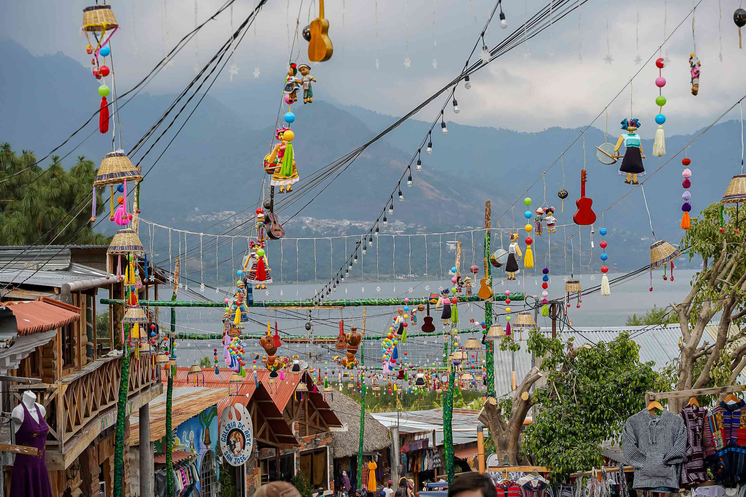 Hanging umbrellas in the colorful streets of San Juan La Laguna at Lake Atitlan, Guatemala