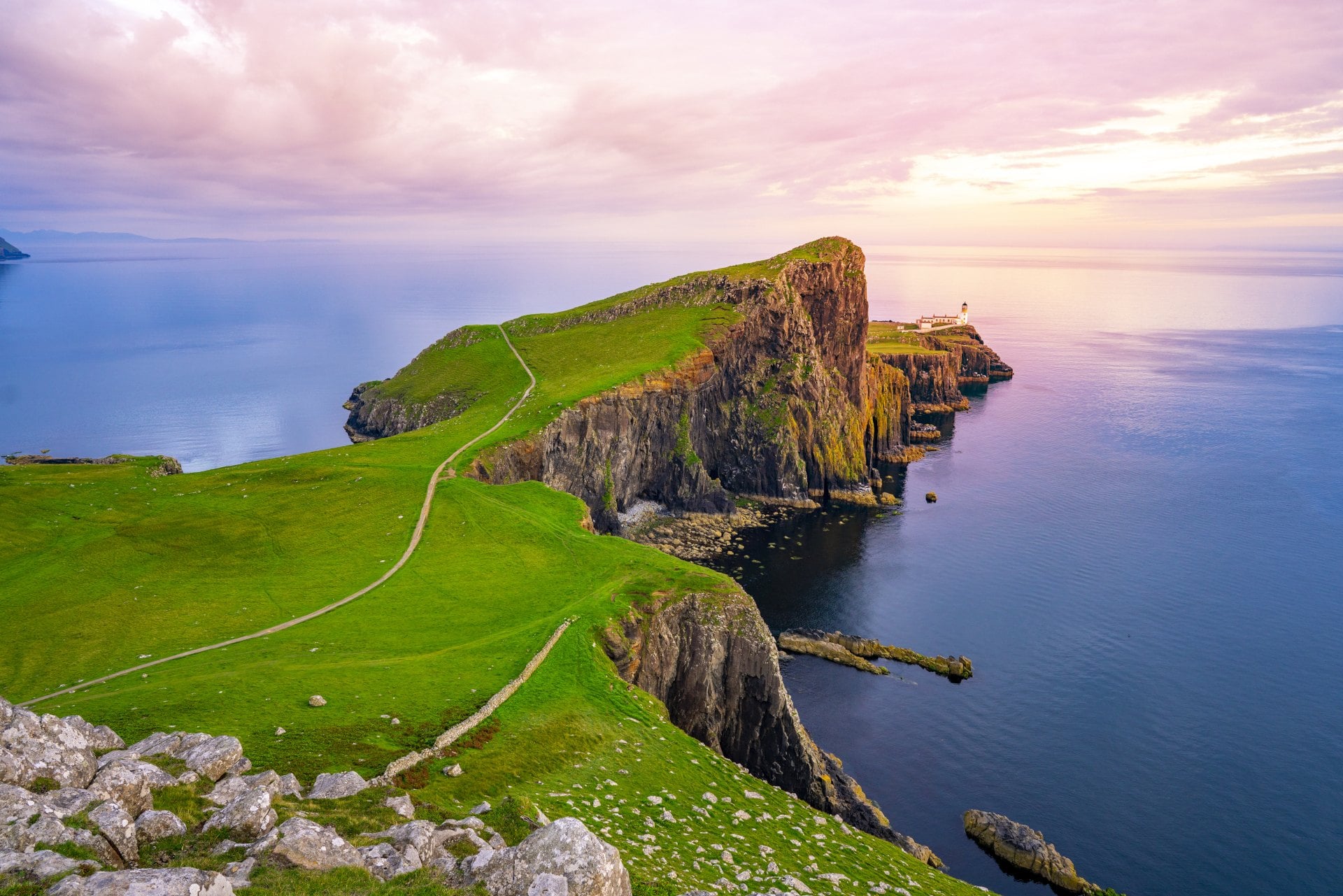 Lightouse at edge of cliff overlooking atlantic ocean